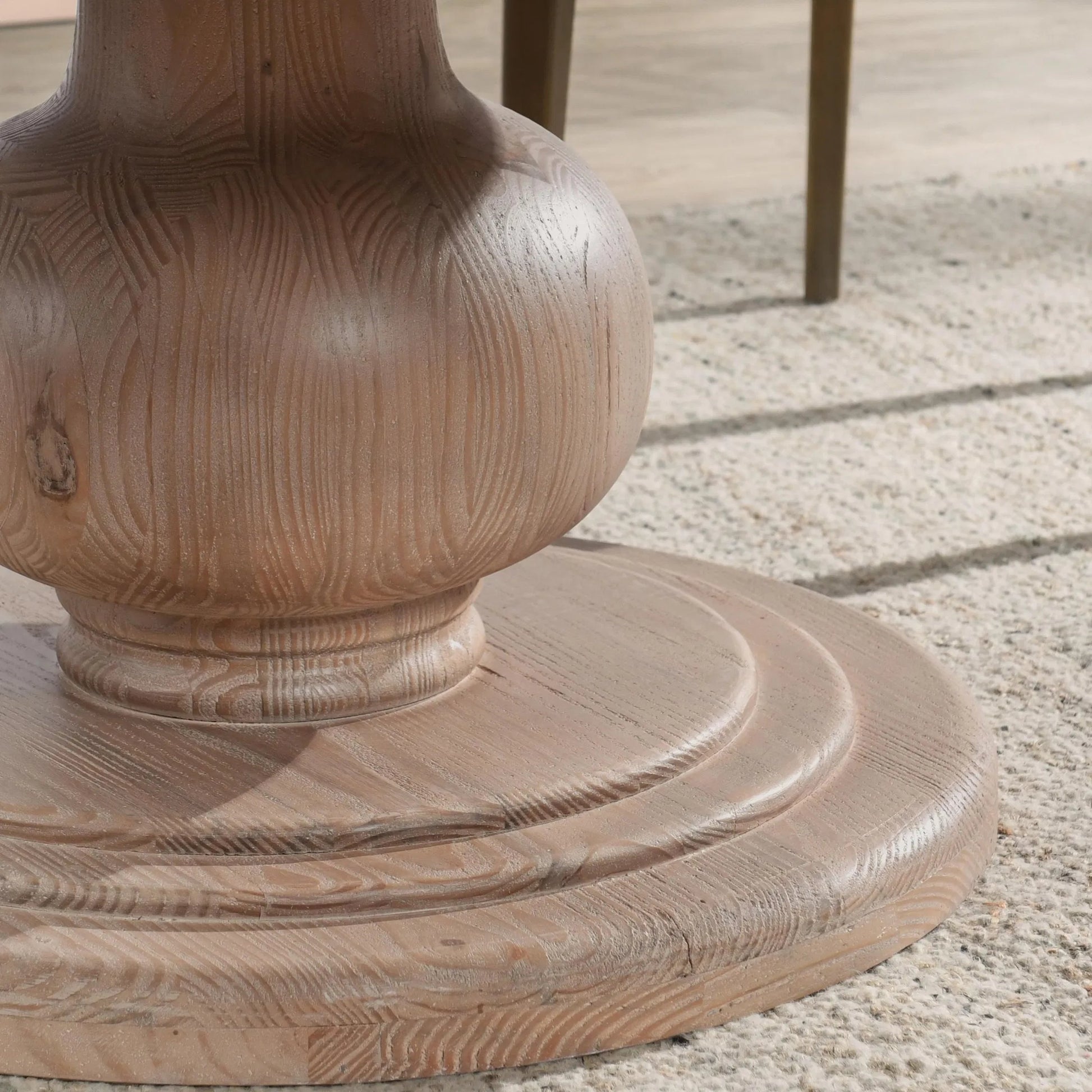 Baldwin 60" Pine Wood Round Dining Table by Kosas Home in taupe. Made from pine wood in a transitional style.