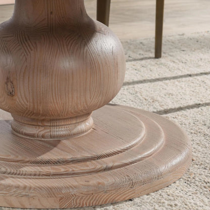 Baldwin 60" Pine Wood Round Dining Table by Kosas Home in taupe. Made from pine wood in a transitional style.