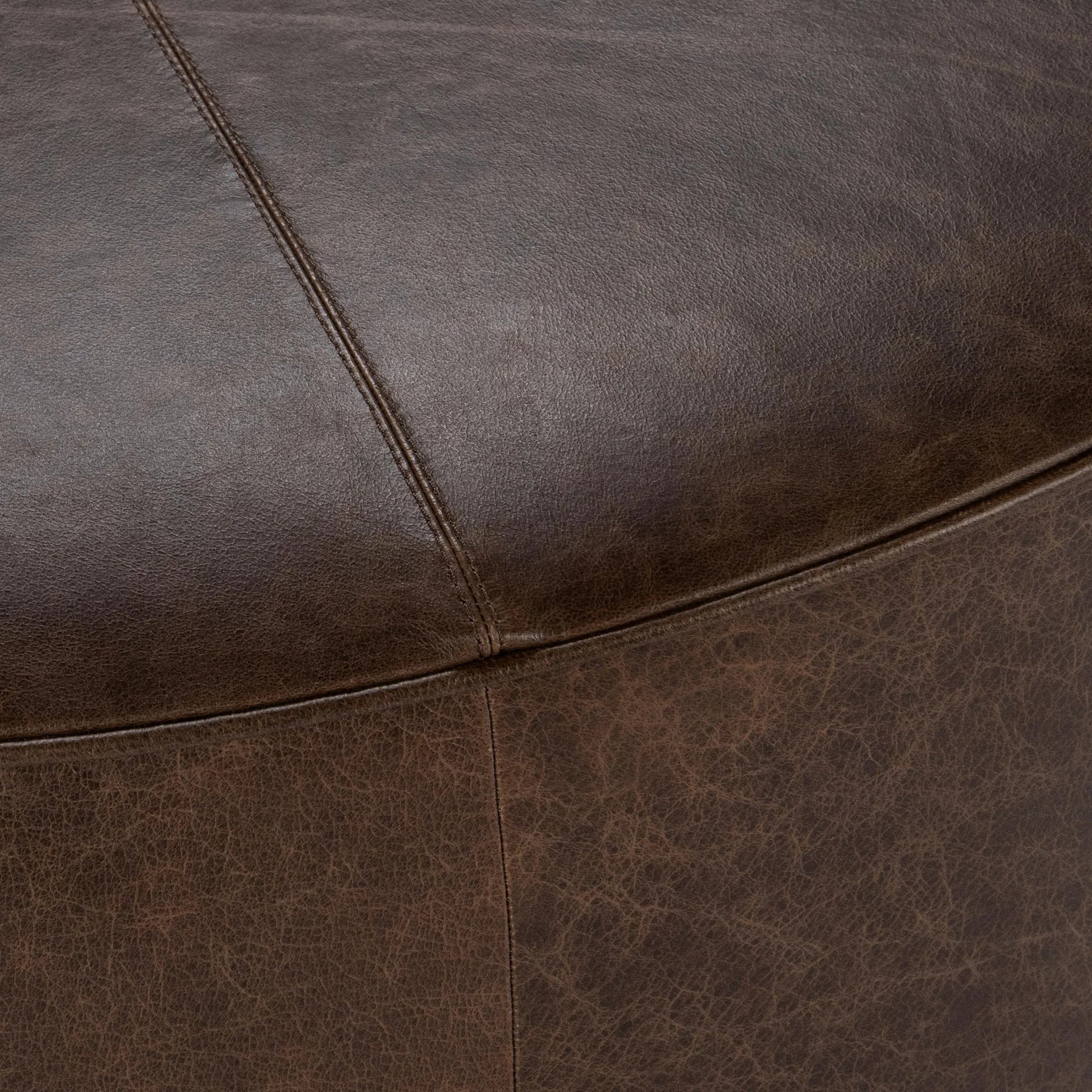 Clair Leather Round Coffee Table by Classic Home in brown, brass. Made from top grain leather in a unique style.