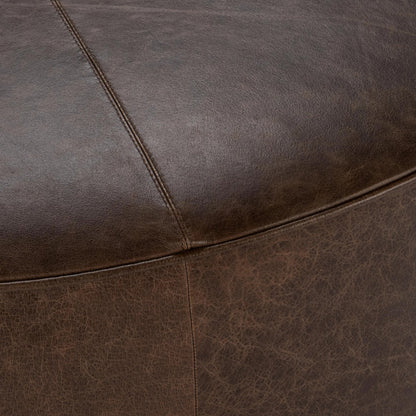 Clair Leather Round Coffee Table by Classic Home in brown, brass. Made from top grain leather in a unique style.