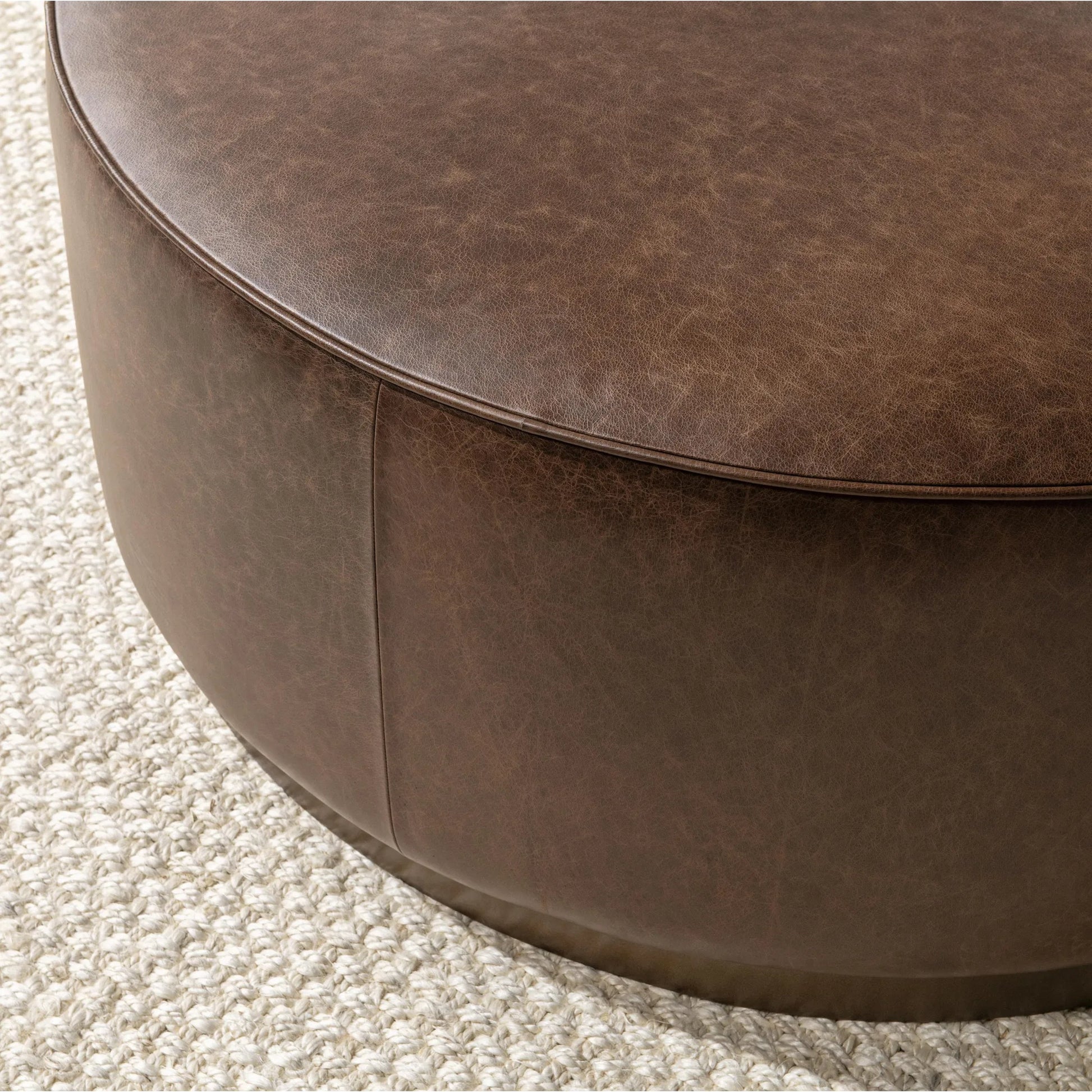 Clair Leather Round Coffee Table by Classic Home in brown, brass. Made from top grain leather in a unique style.