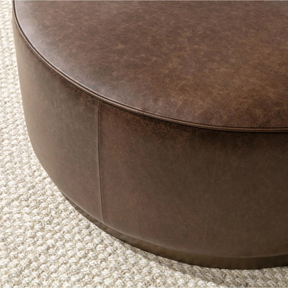 Clair Leather Round Coffee Table by Classic Home in brown, brass. Made from top grain leather in a unique style.