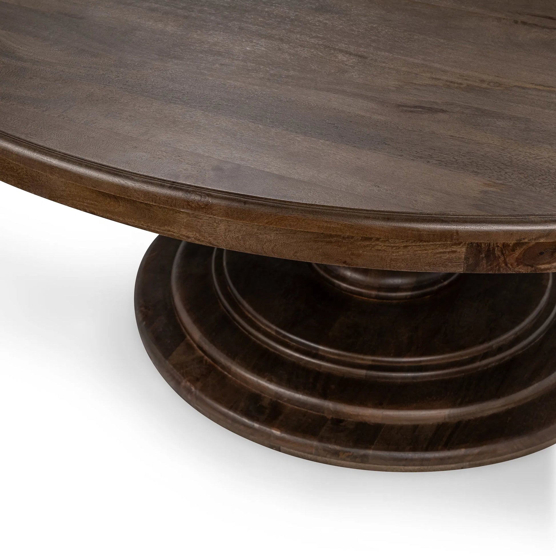 Brookside Round Mango Wood Dinning Table by Classic Home in cocoa brown. Made from mango wood in a traditional style.