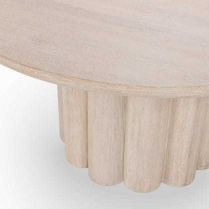 Beau Mango Wood Round Dining Table by Kosas Home in matte natural. Made from mango wood in a transitional style.