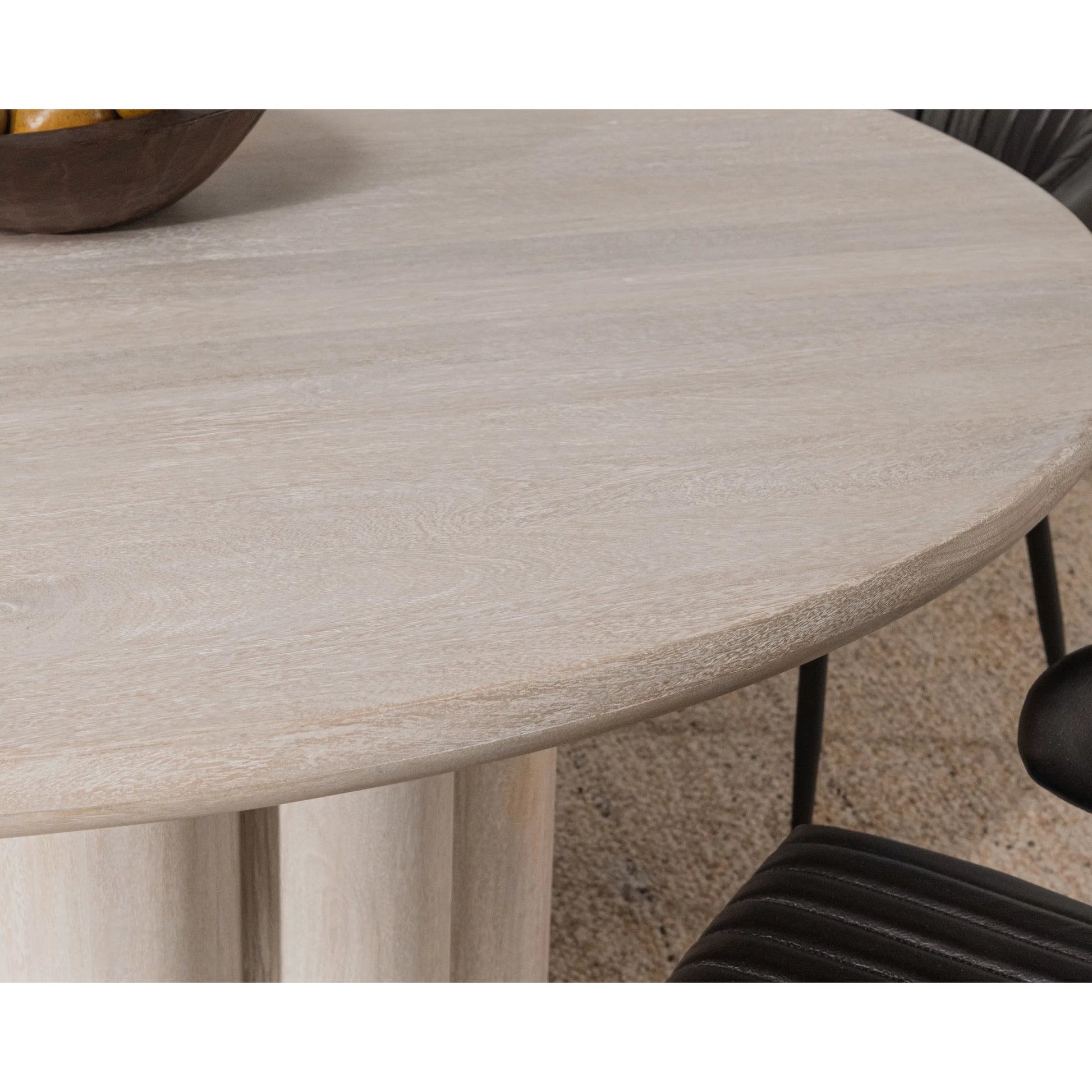 Beau Mango Wood Round Dining Table by Kosas Home in matte natural. Made from mango wood in a transitional style.