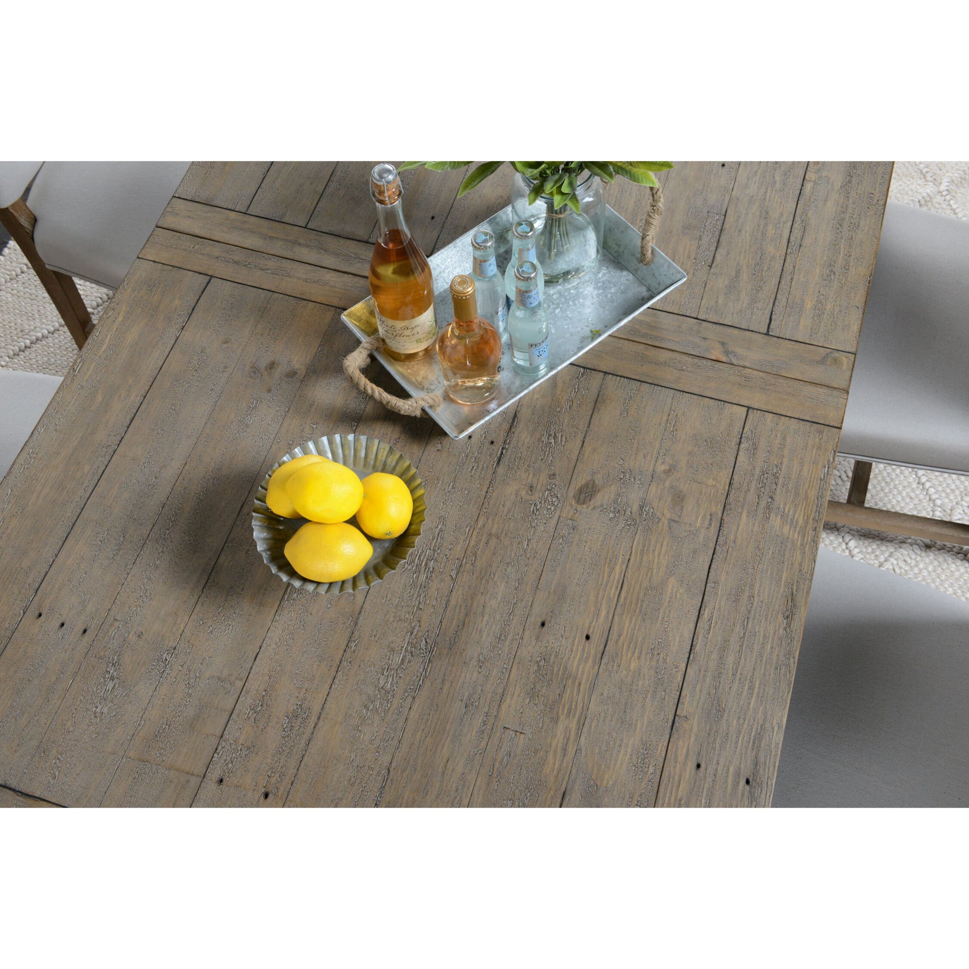 Driftwood Extension Dining Table by Kosas Home in desert gray. Made from reclaimed pine wood in a rustic style.
