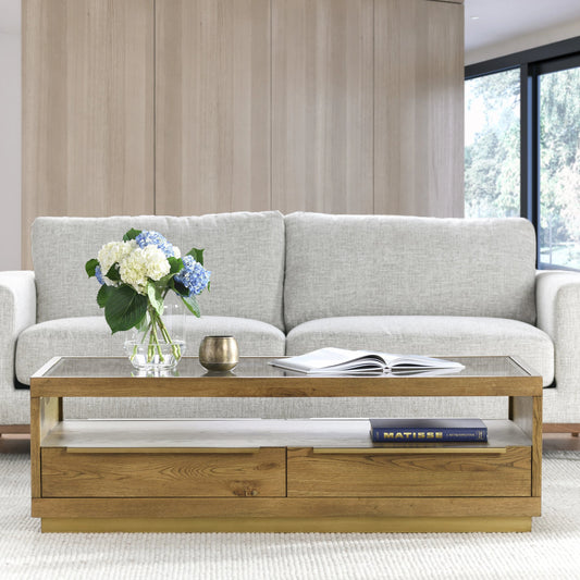 Fallbook Four-Drawer Coffee Table by Classic Home in brown, gold. Made from oak veneer, metal, glass in a modern style.