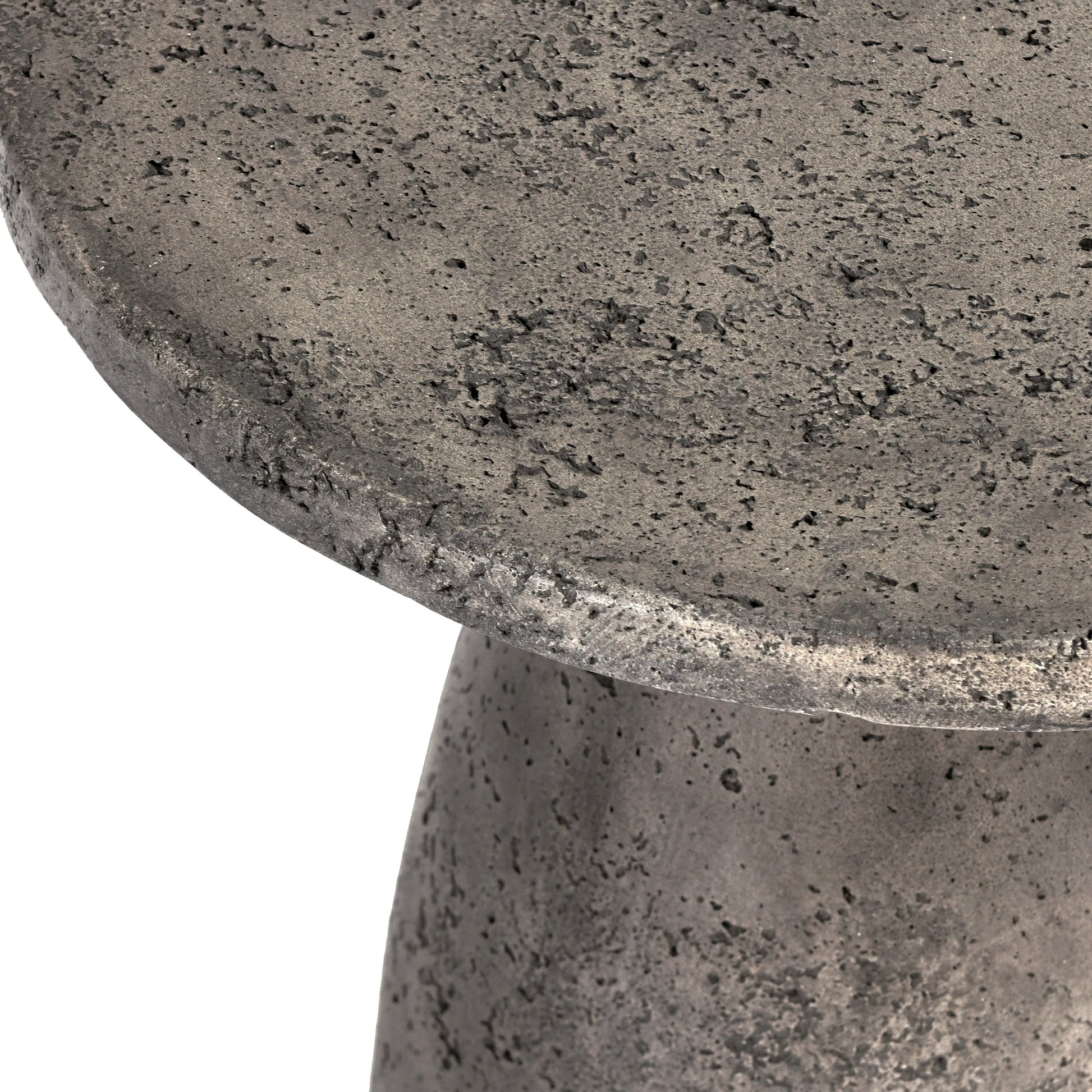 Collins Round Outdoor Accent Table by Classic Home. Made from concrete in a modern style.