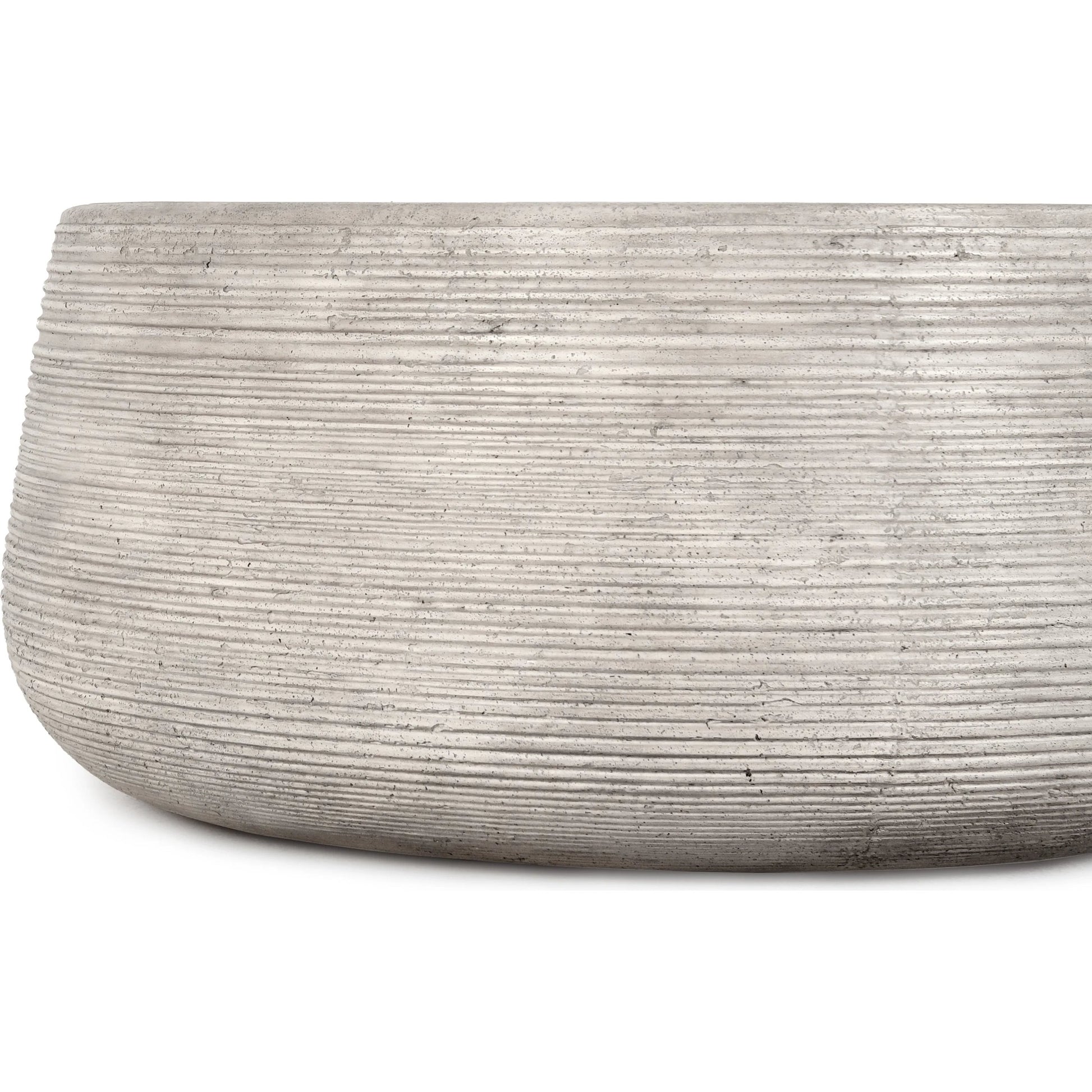 Nellie Round Outdoor Coffee Table by Classic Home in rough light grey. Made from concrete in a modern style.