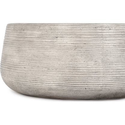 Nellie Round Outdoor Coffee Table by Classic Home in rough light grey. Made from concrete in a modern style.