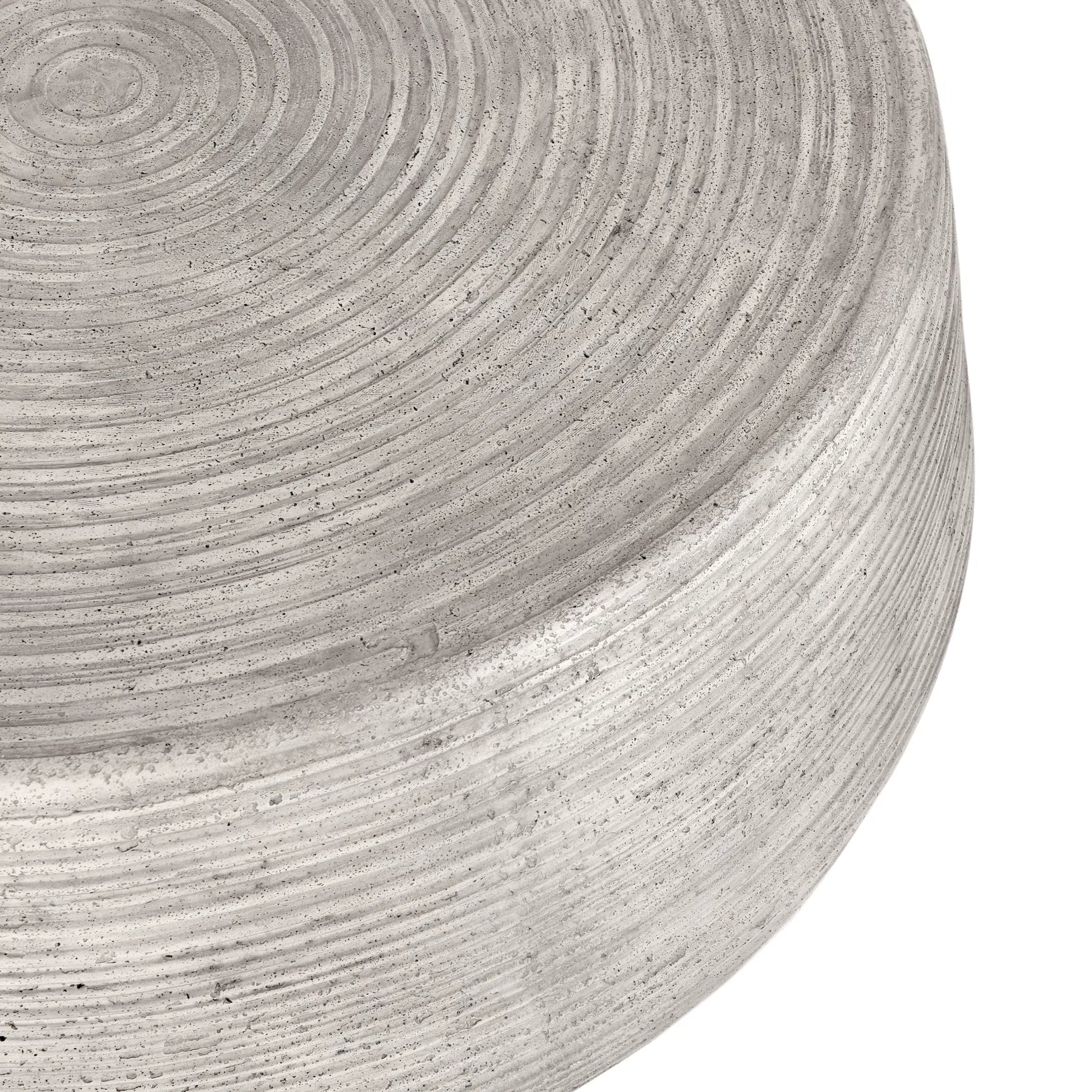 Nellie Round Outdoor Coffee Table by Classic Home in rough light grey. Made from concrete in a modern style.