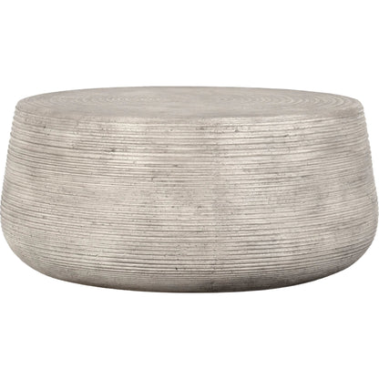 Nellie Round Outdoor Coffee Table by Classic Home in rough light grey. Made from concrete in a modern style.