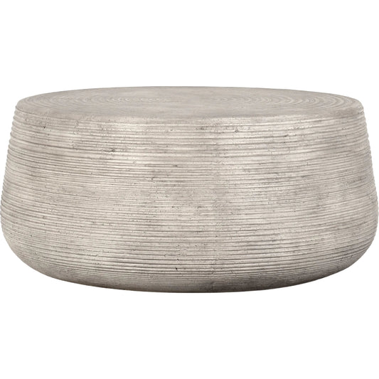 Nellie Round Outdoor Coffee Table by Classic Home in rough light grey. Made from concrete in a modern style.