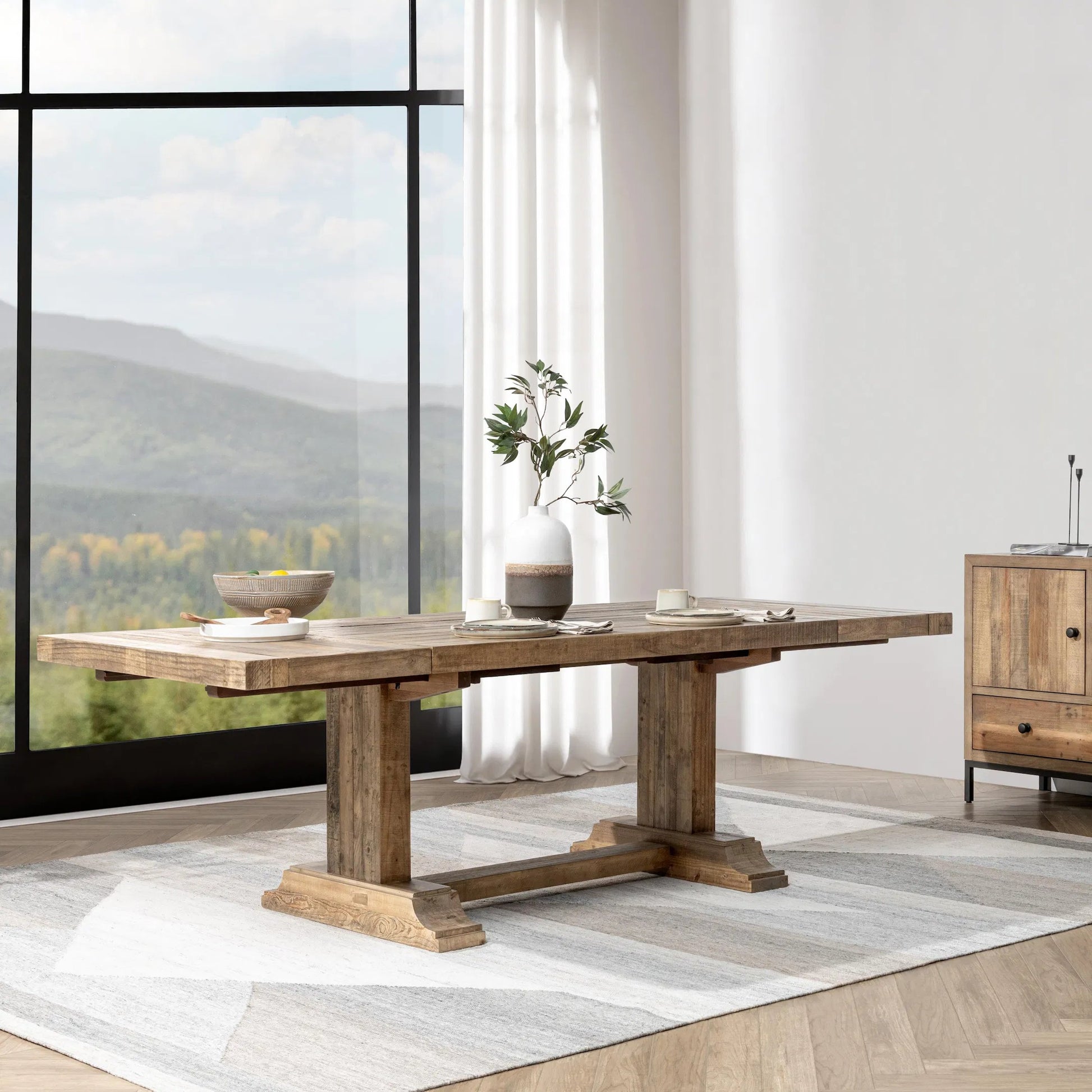 Dita Reclaimed Pine Wood Extendable Dining Table by Kosas Home in natural. Made from reclaimed pine in a transitional style.