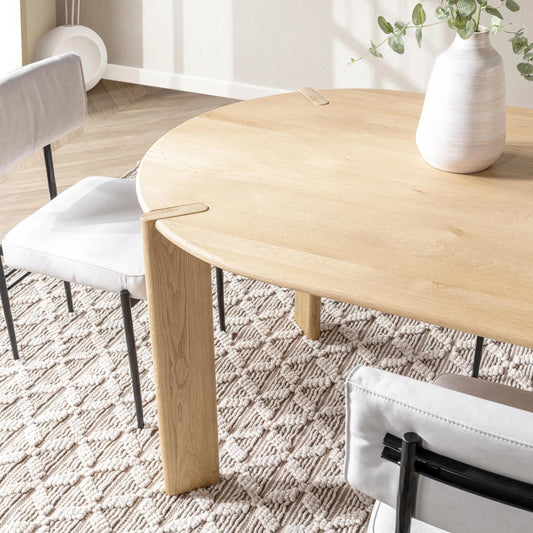 Kering Oak Wood Oval Dining Table by Kosas Home in natural. Made from solid oak wood in a unique style.