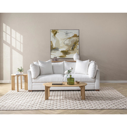 Kering Oak Wood Oval Coffee Table by Kosas Home in natural. Made from solid oak wood in a unique style.