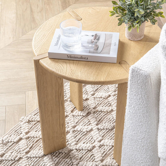 Kering Oak Wood Round End Table by Kosas Home in natural. Made from solid oak wood in a unique style.