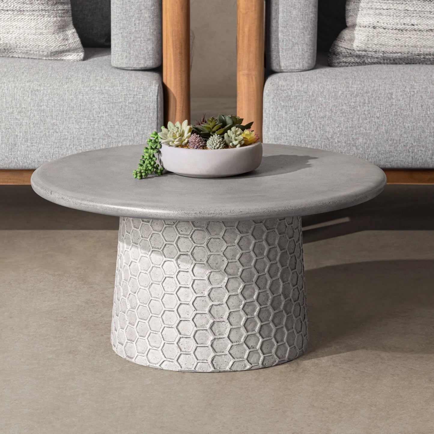 007 SI-2533206 | Lifestyle | Delaine Outdoor Concrete Coffee Table by Classic Home in light gray. Made from glass fiber reinforced concrete in a unique style.
