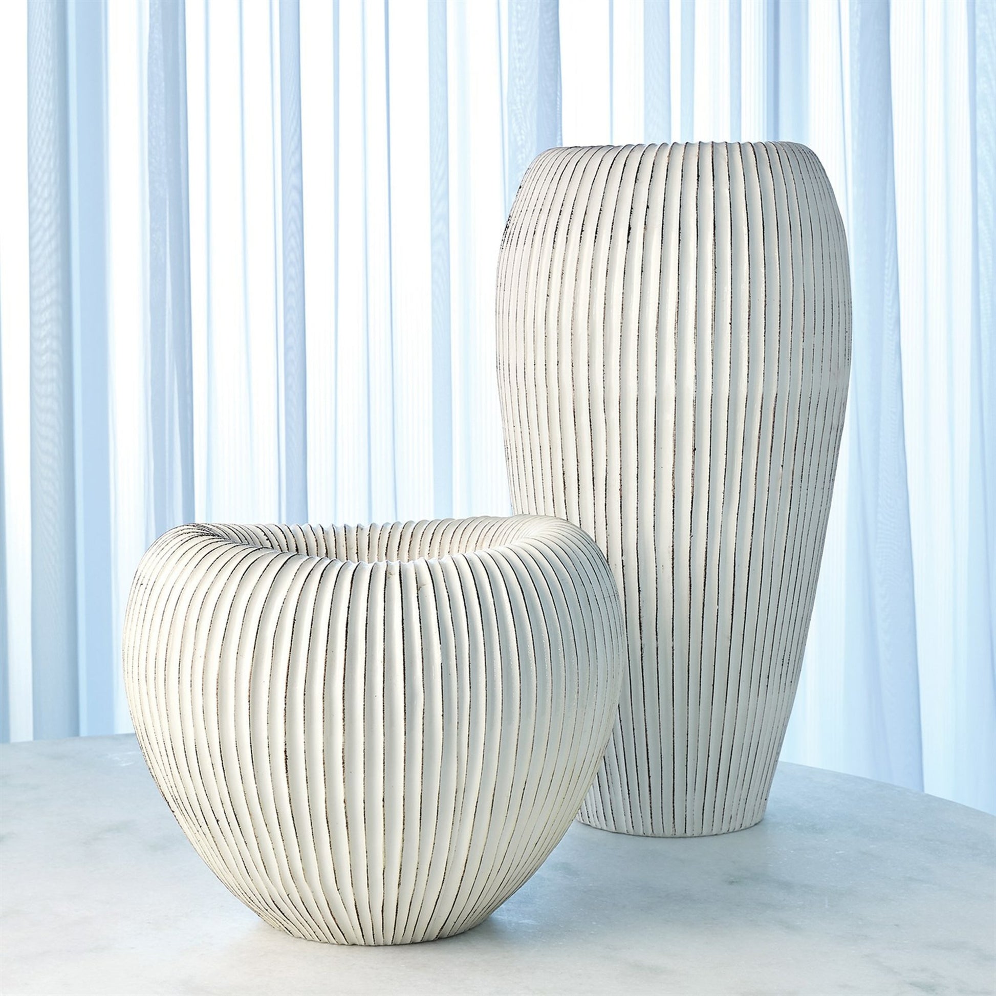 Baleen Cachepot by Global Views in ivory. Made from ceramic in a coastal style.