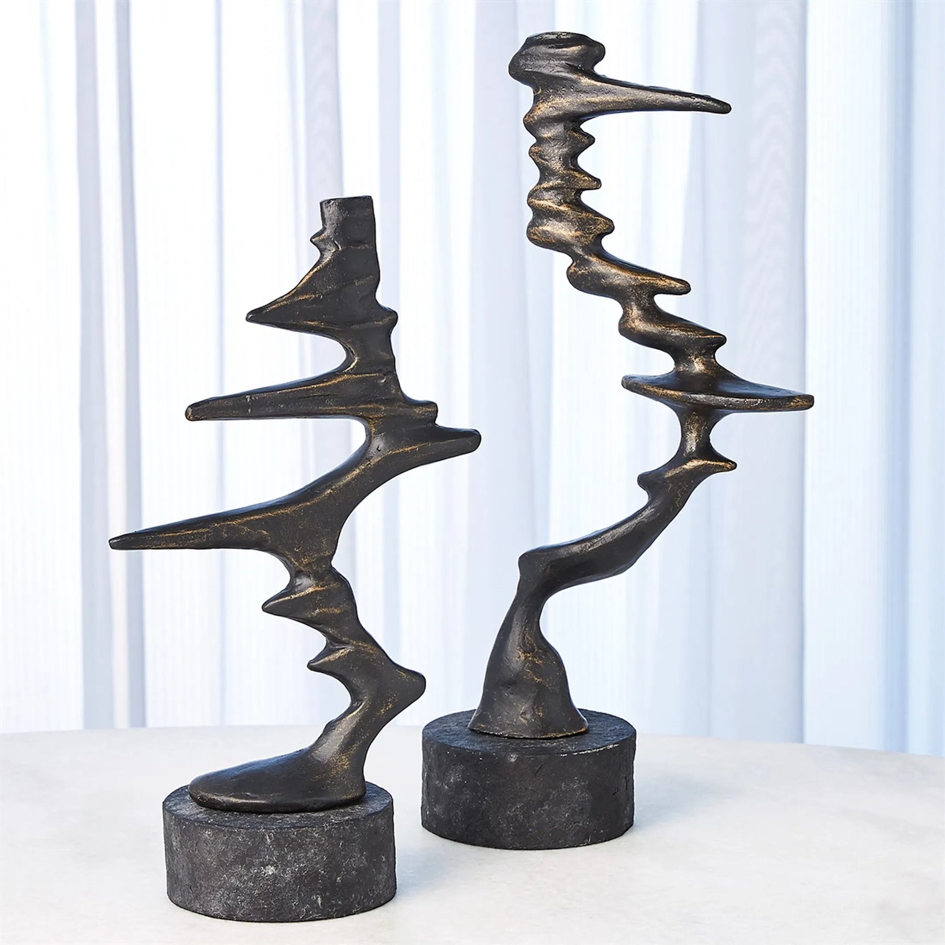 Wind Blown Sculpture by Global Views. Made from cast iron, granite in a eclectic & global style.