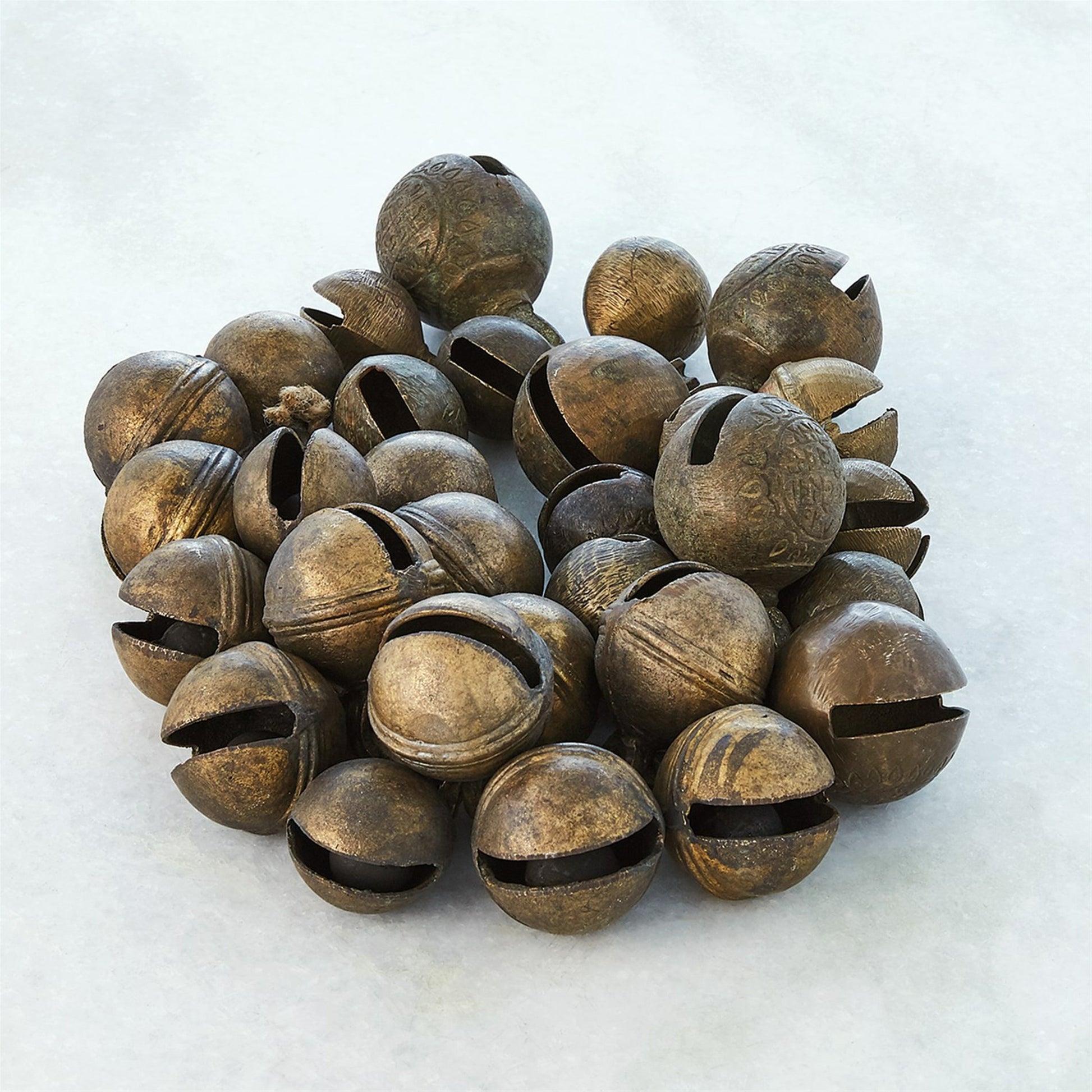 Brass Bell Cluster by Global Views. Made from brass, jute in a rustic style.