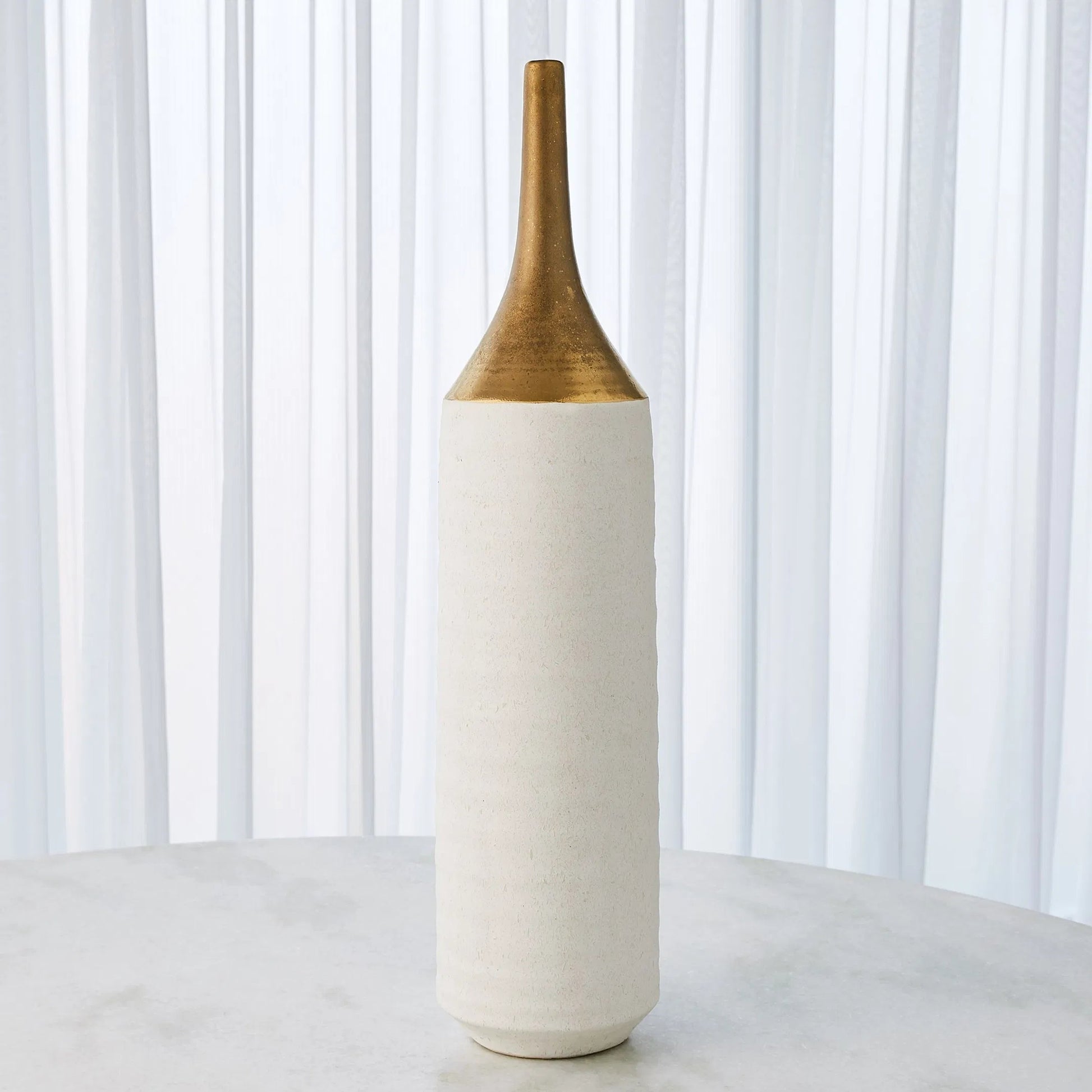 Two Toned Vase by Global Views in gold. Made from ceramic in a eclectic & global style.
