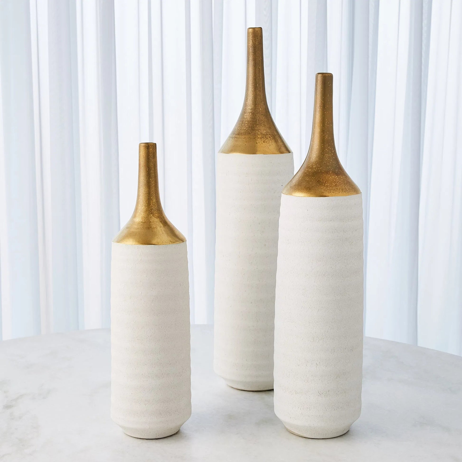 Two Toned Vase by Global Views in gold. Made from ceramic in a eclectic & global style.