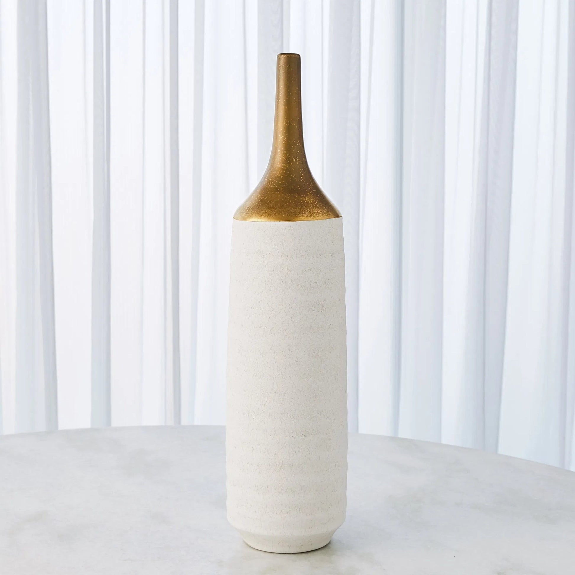 Two Toned Vase by Global Views in gold. Made from ceramic in a eclectic & global style.
