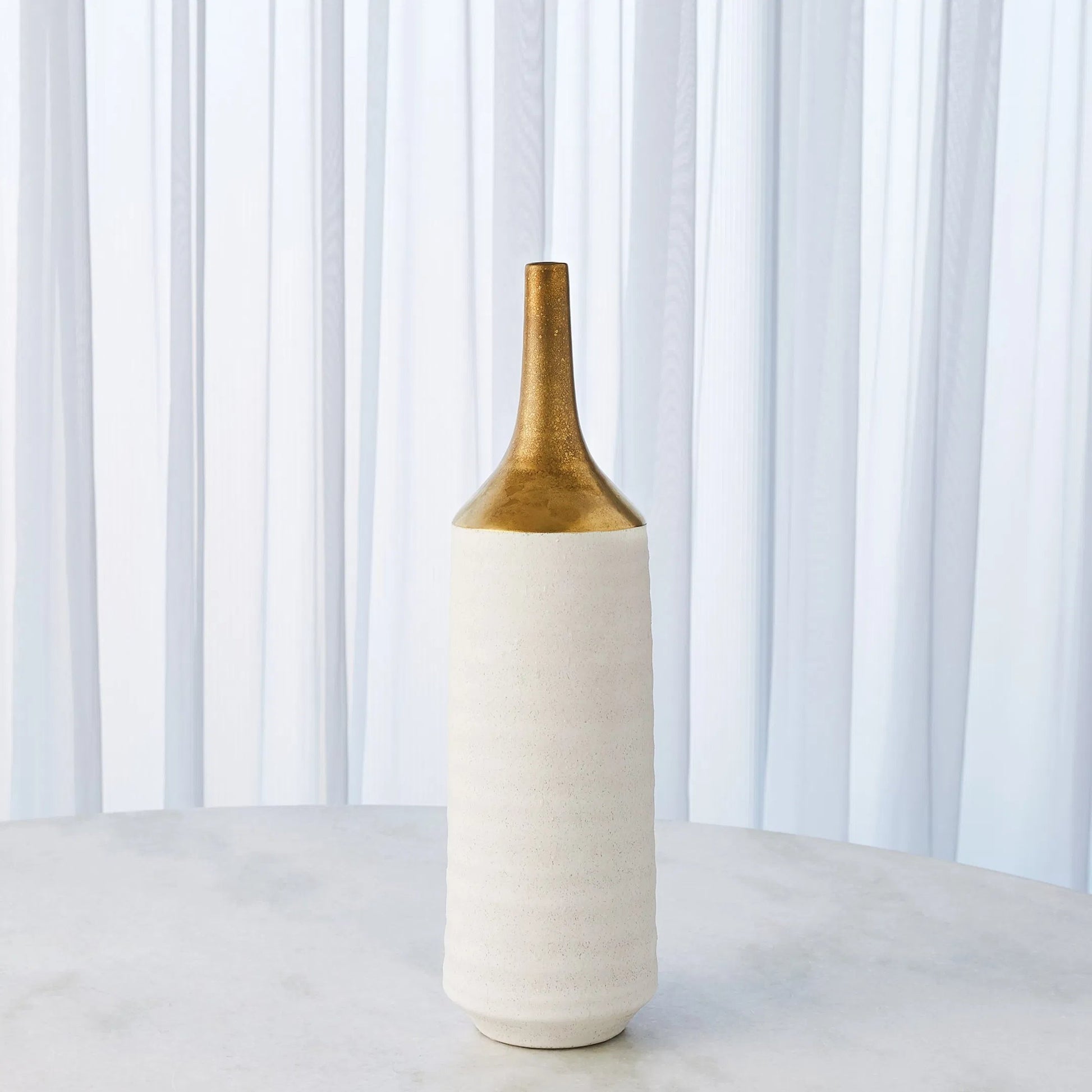 Two Toned Vase by Global Views in gold. Made from ceramic in a eclectic & global style.