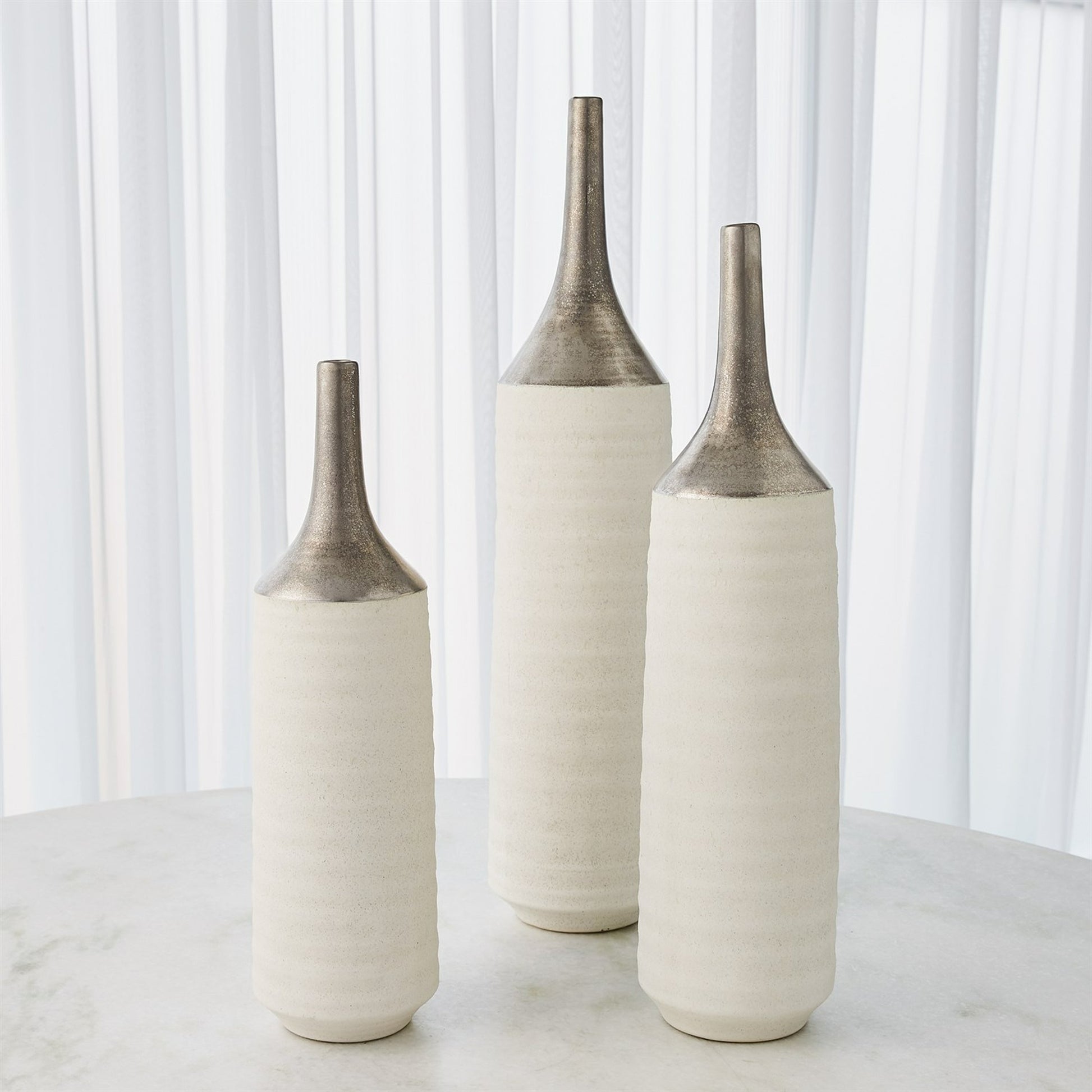 Two Toned Vase by Global Views in gold. Made from ceramic in a eclectic & global style.