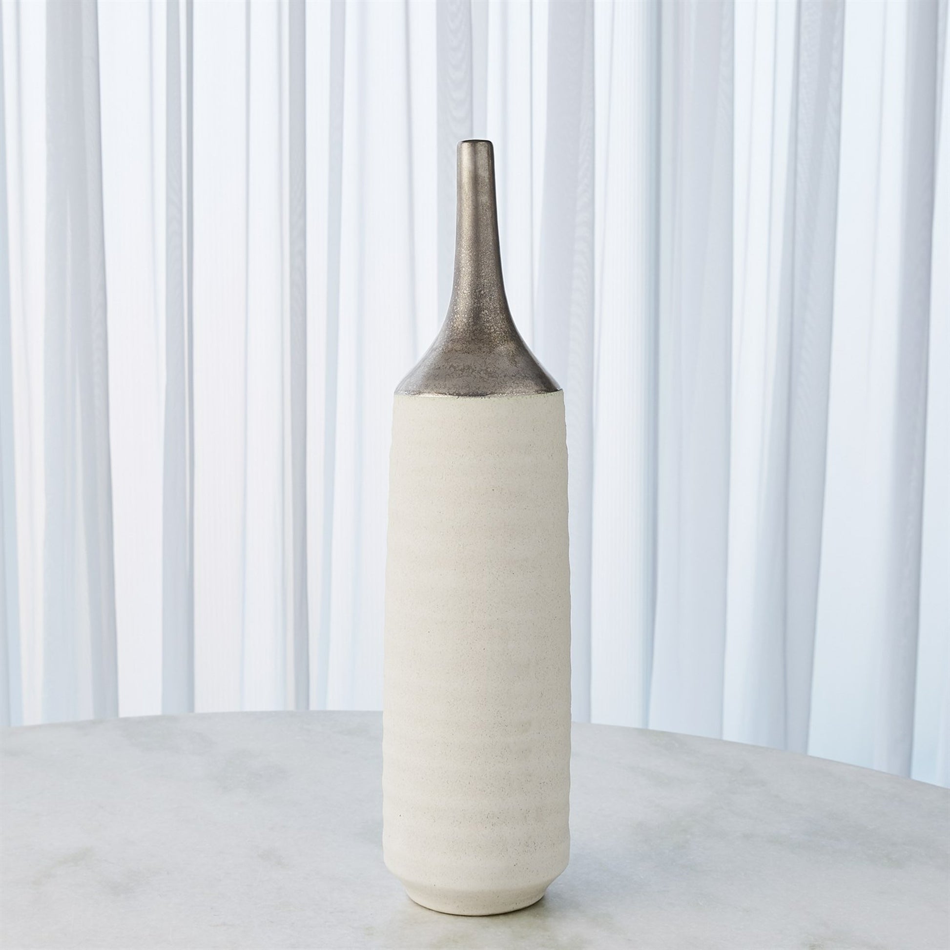 Two Toned Vase by Global Views in gold. Made from ceramic in a eclectic & global style.