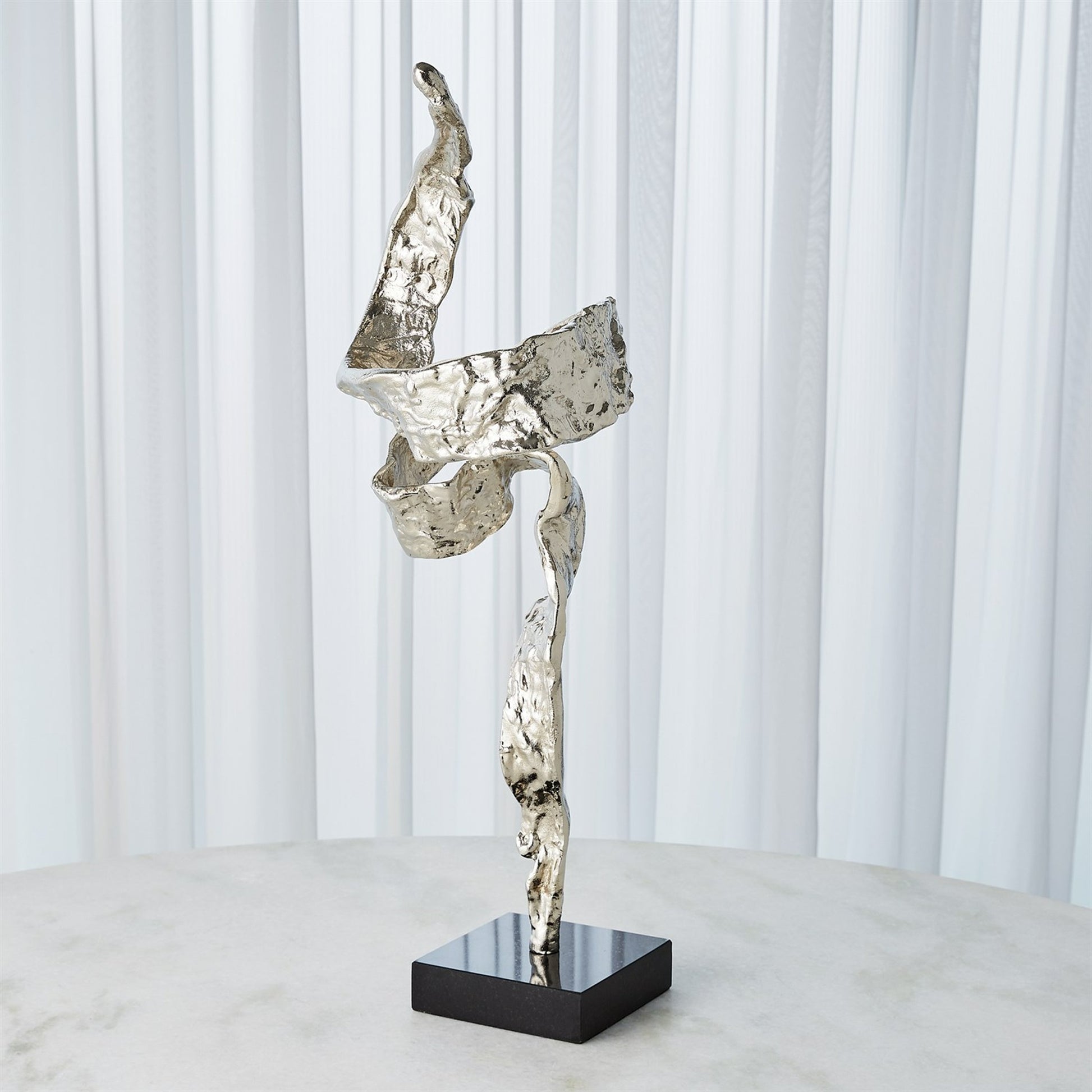 Twist Sculpture by Global Views. Made from unique in a transitional style.
