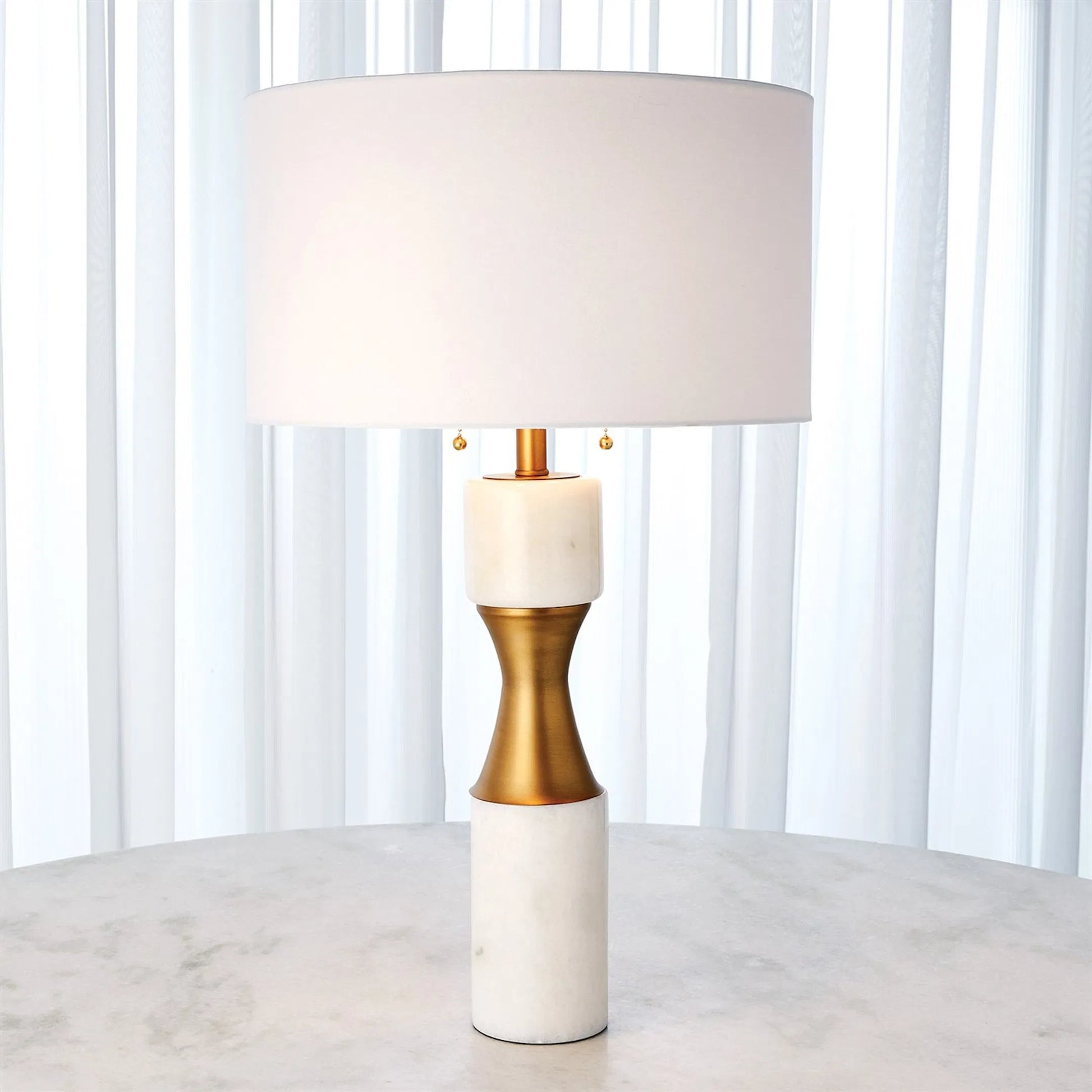 Marble Cinch Lamp by Global Views. Made from marble, brass in a transitional style.
