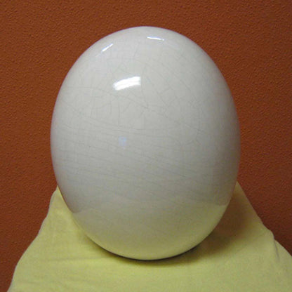 Ivory Crackle Egg by Global Views. Made from ceramic in a modern style.