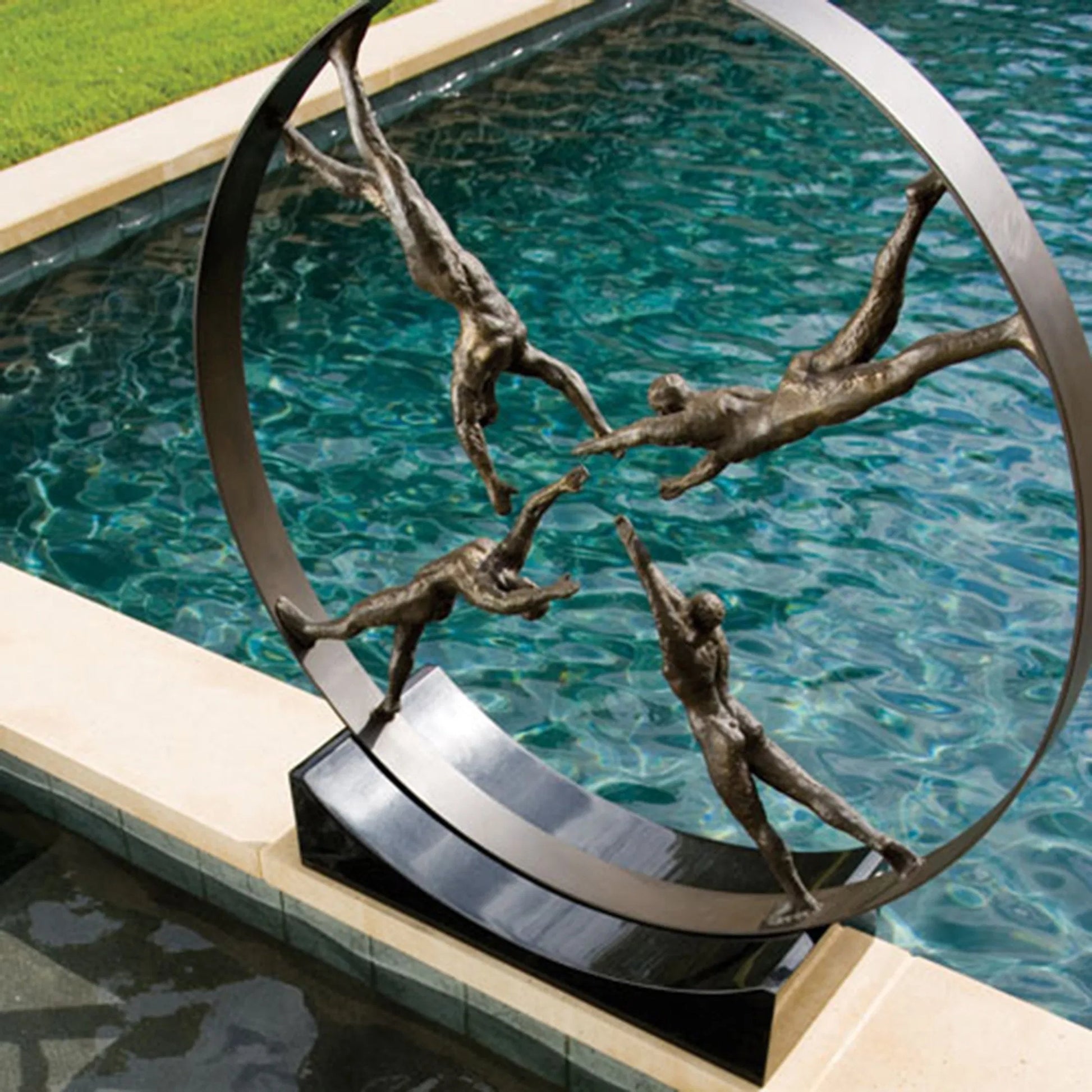 Reaching for Center Sculpture by Global Views. Made from iron, granite in a eclectic & global style.