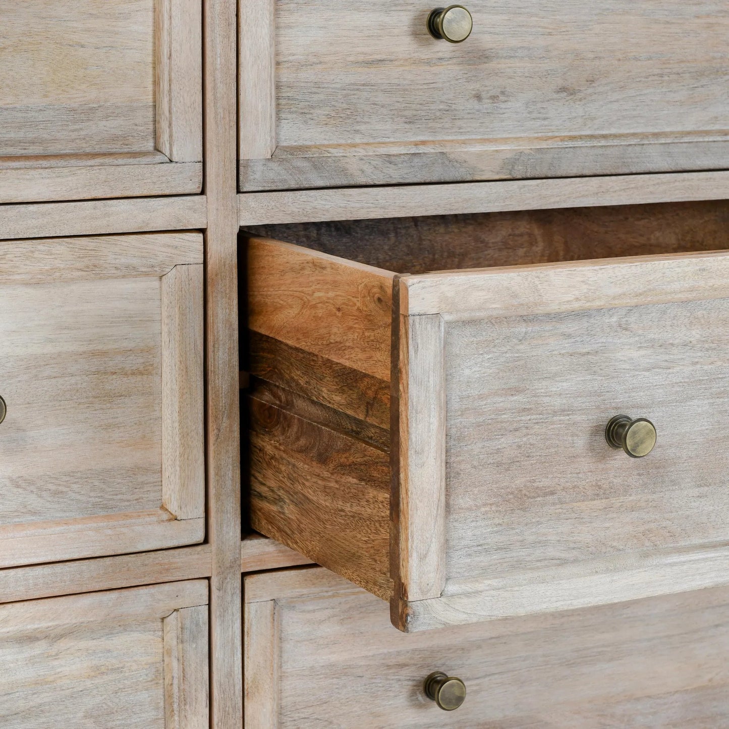 006 SI-2256329 | Closeup | Adelaide 9-Drawer Mango Wood Dresser by Classic Home in white wash. Made from mango wood in a transitional style.
