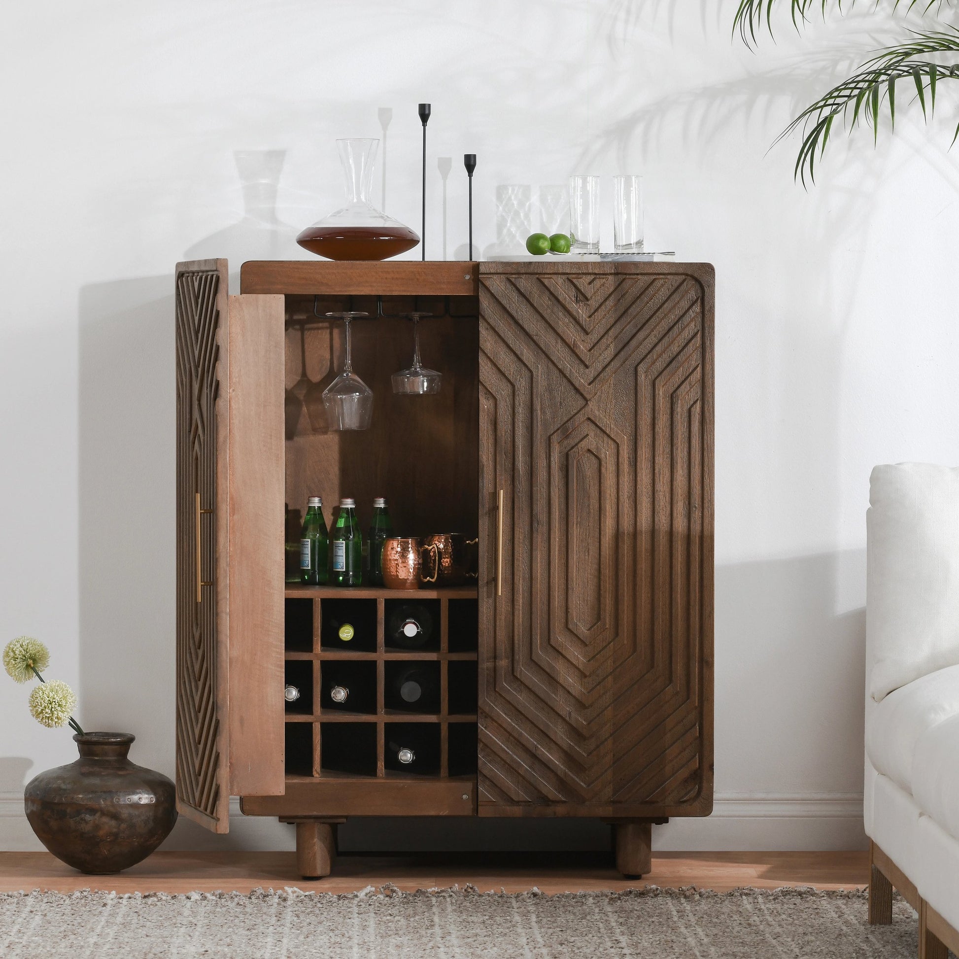 Holmes Mango Wood Carved Bar Cabinet by Classic Home in brown. Made from mango wood in a modern style.