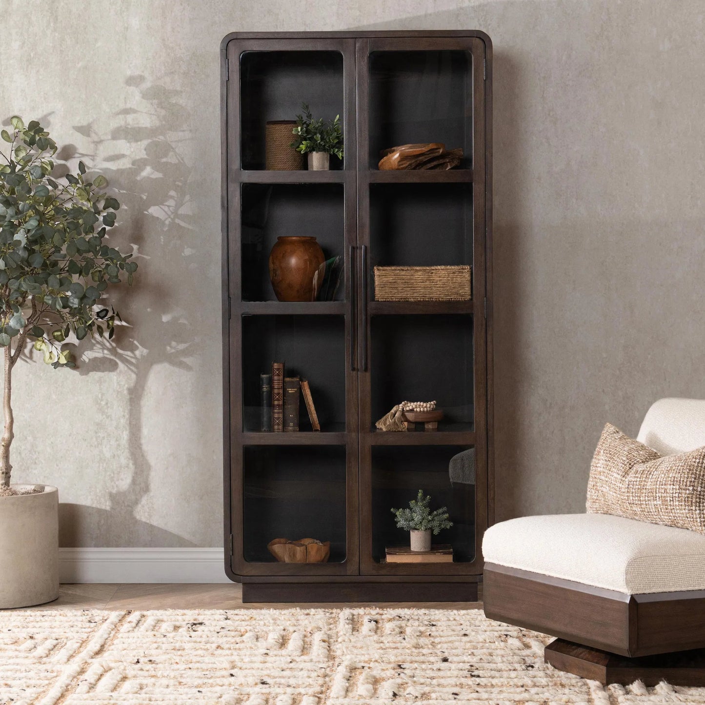 022 SI-2388527 | Lifestyle | Rogers Mango Wood Curio Cabinet by Classic Home in brown. Made from mango wood in a modern style.