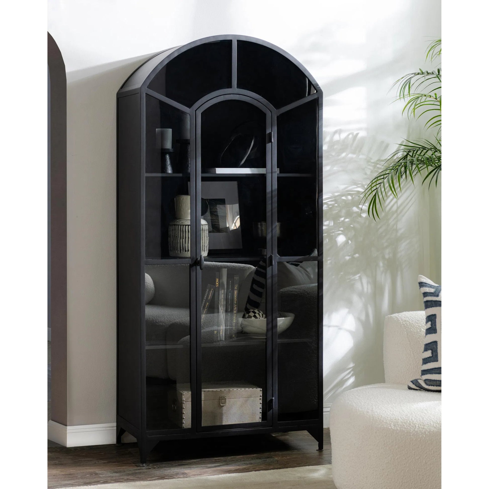 Lillo Metal Curio Cabinet by Classic Home in black. Made from metal in a modern style.