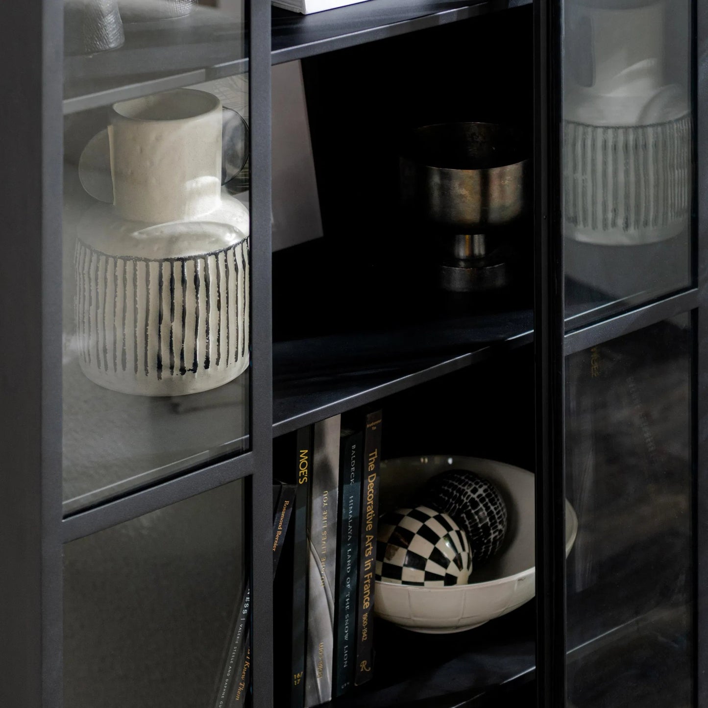 004 SI-2259096 | Closeup | Lillo Metal Curio Cabinet by Classic Home in black. Made from metal in a modern style.