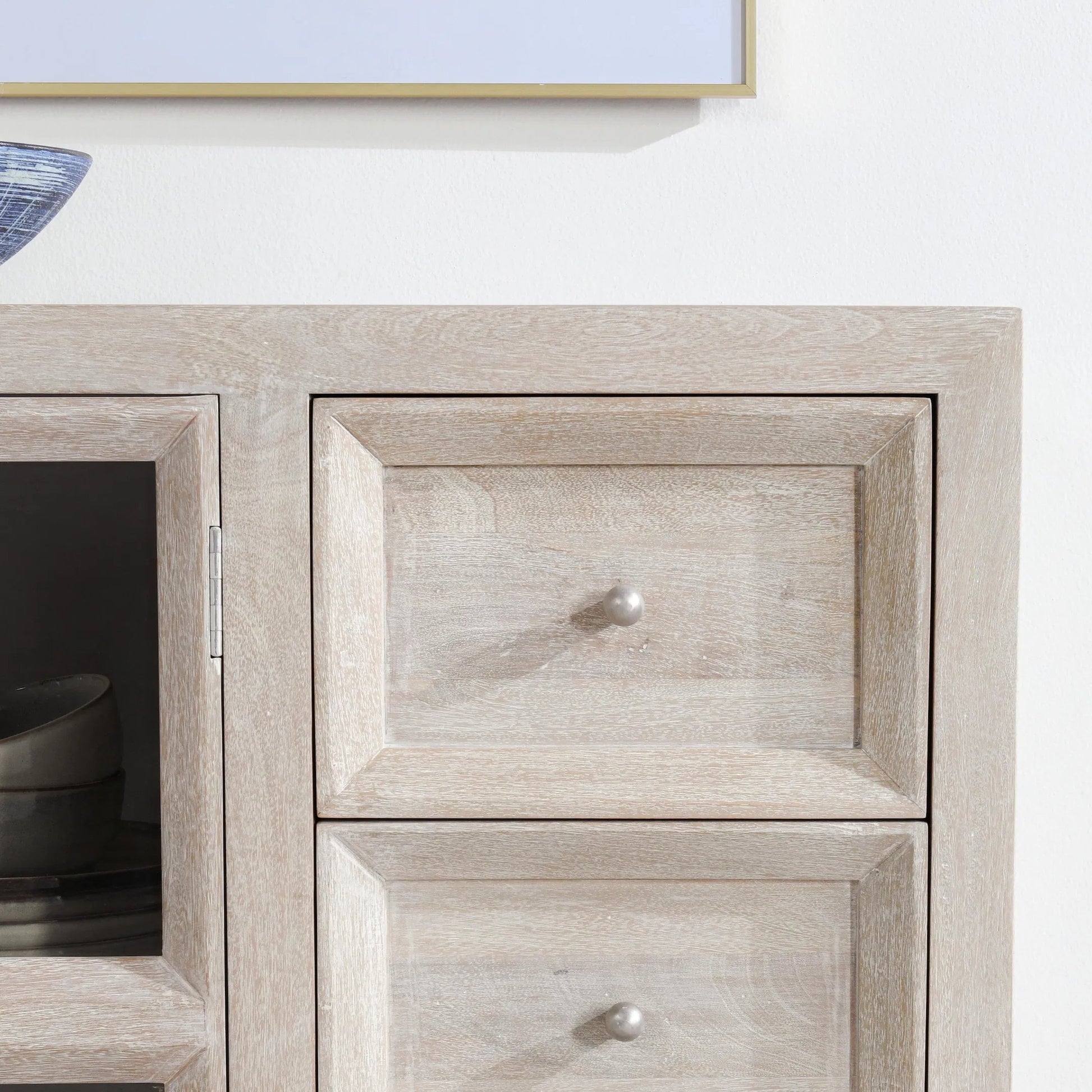 Isha Mango Wood Cabinet by Classic Home in whitewash. Made from mango wood, tempered glass in a transitional style.