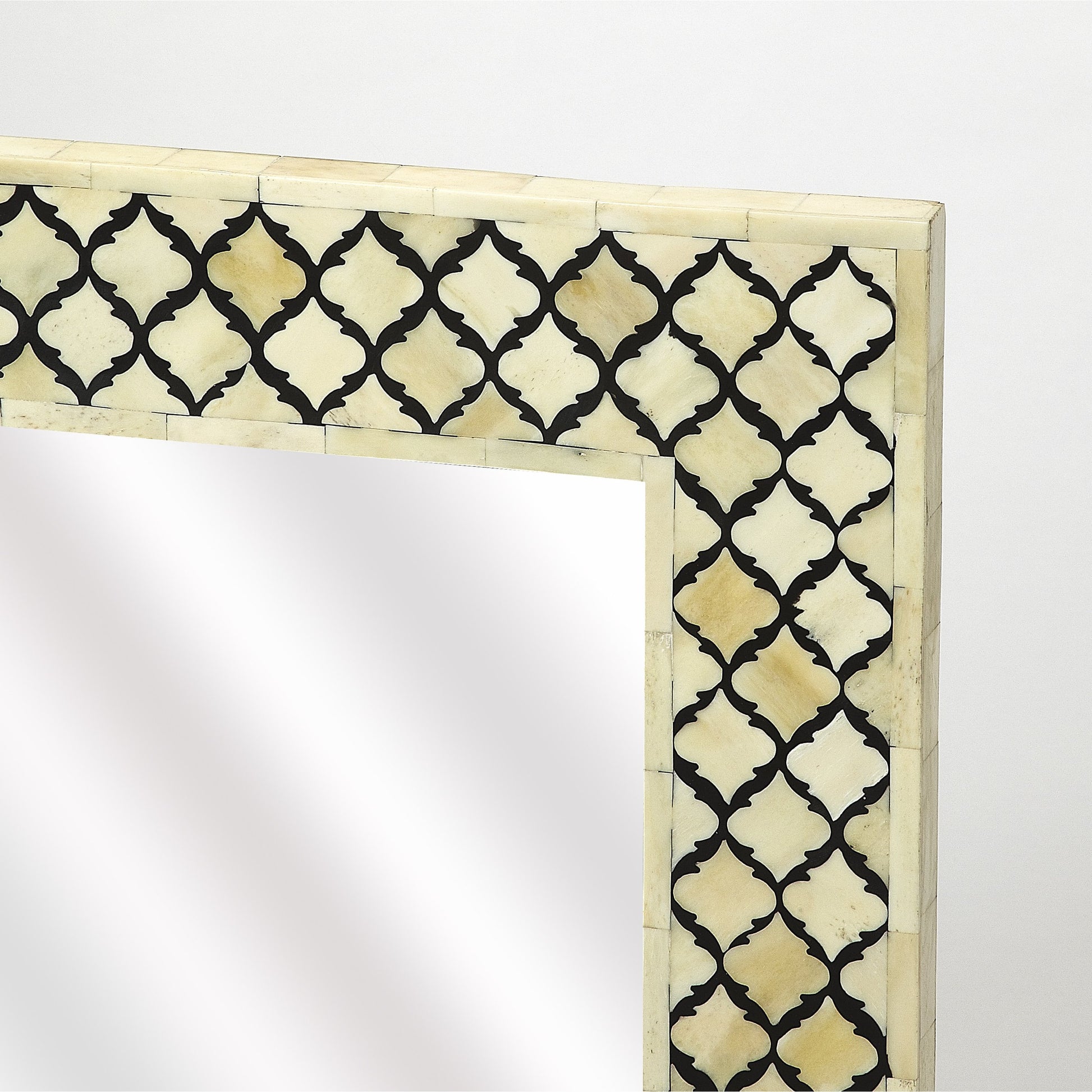 Yasmin Bone Inlay Wall Mirror by Butler Specialty Company in off white and black bone inlay. Made from mdf, bone inlay, resin, mirror glass in a eclectic & global style.