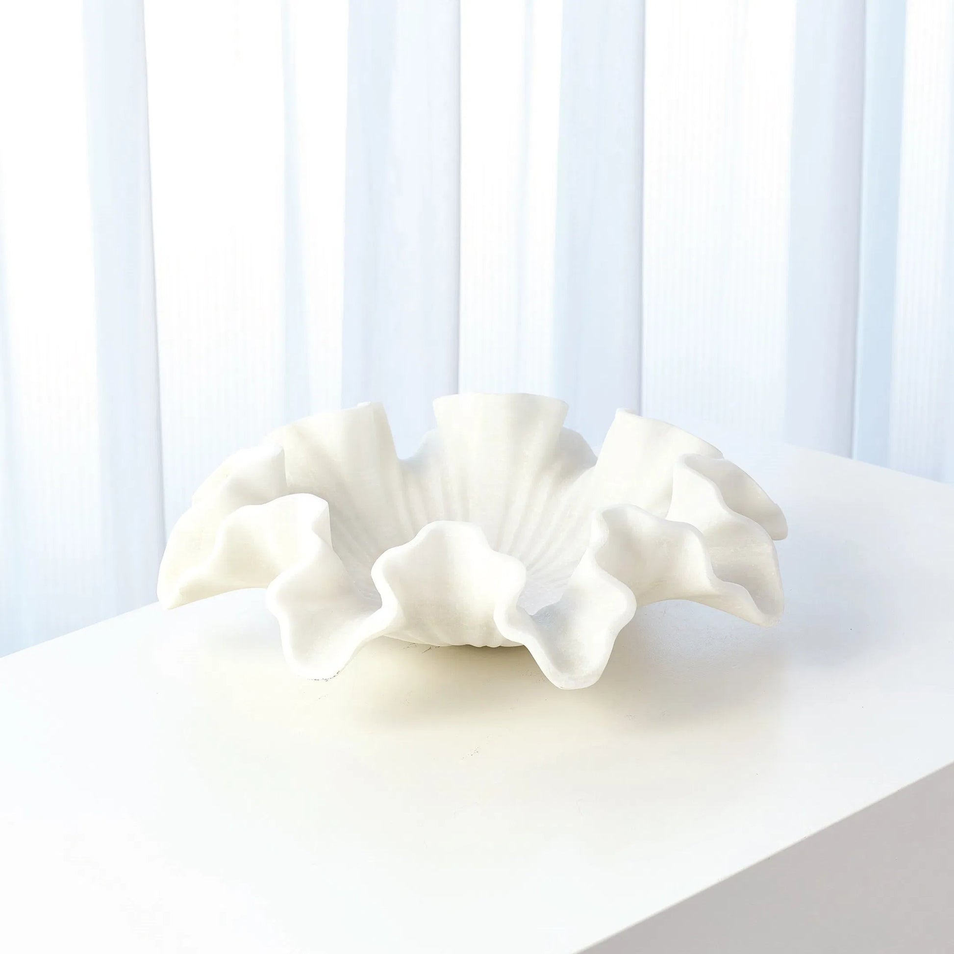 Marble Ruffle Bowl by Global Views in white. Made from rajnagar marble in a coastal style.