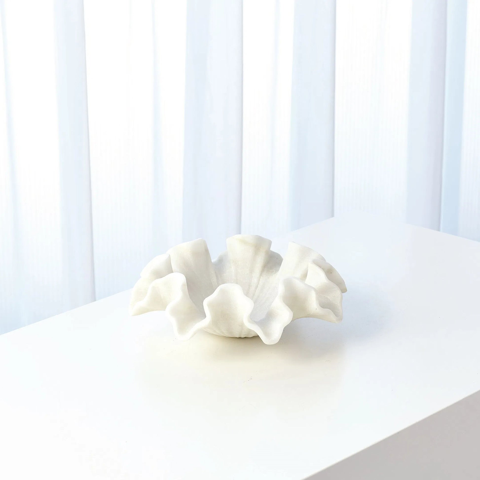 Marble Ruffle Bowl by Global Views in white. Made from rajnagar marble in a coastal style.