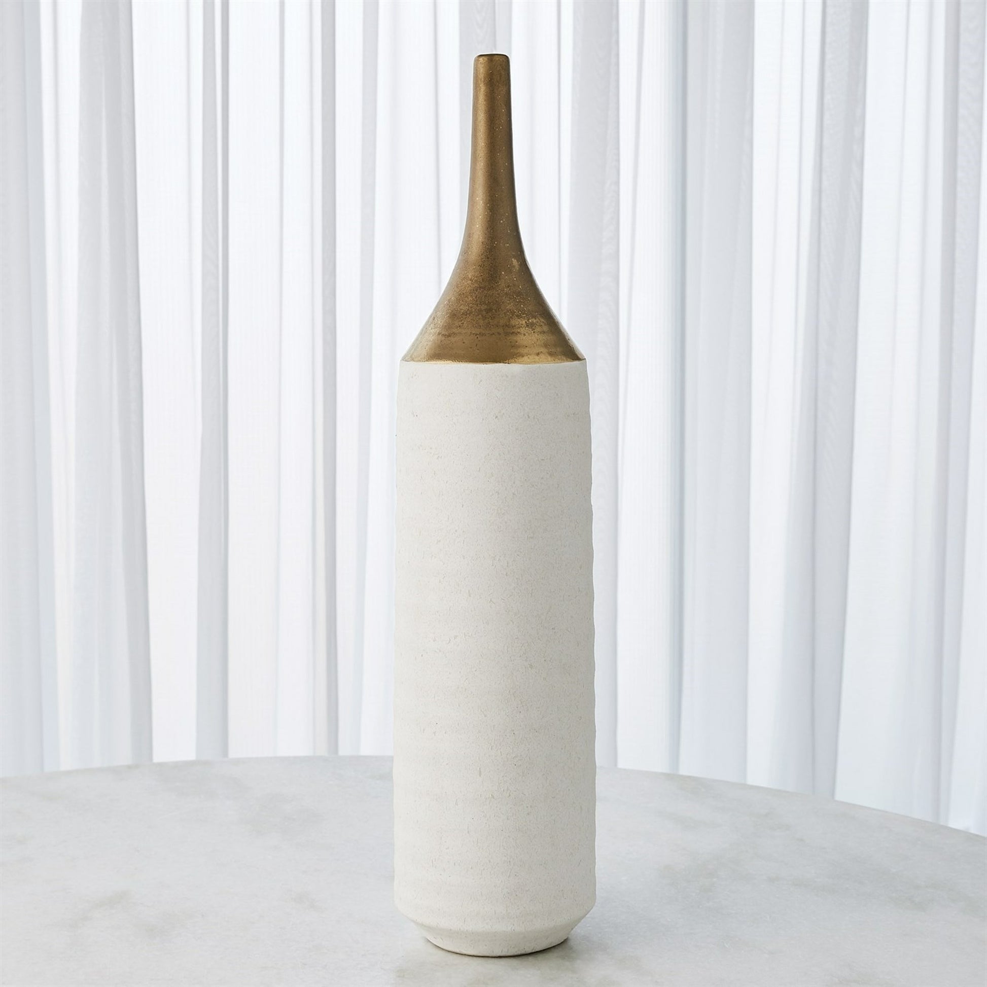 Two Toned Vase by Global Views in gold. Made from ceramic in a eclectic & global style.
