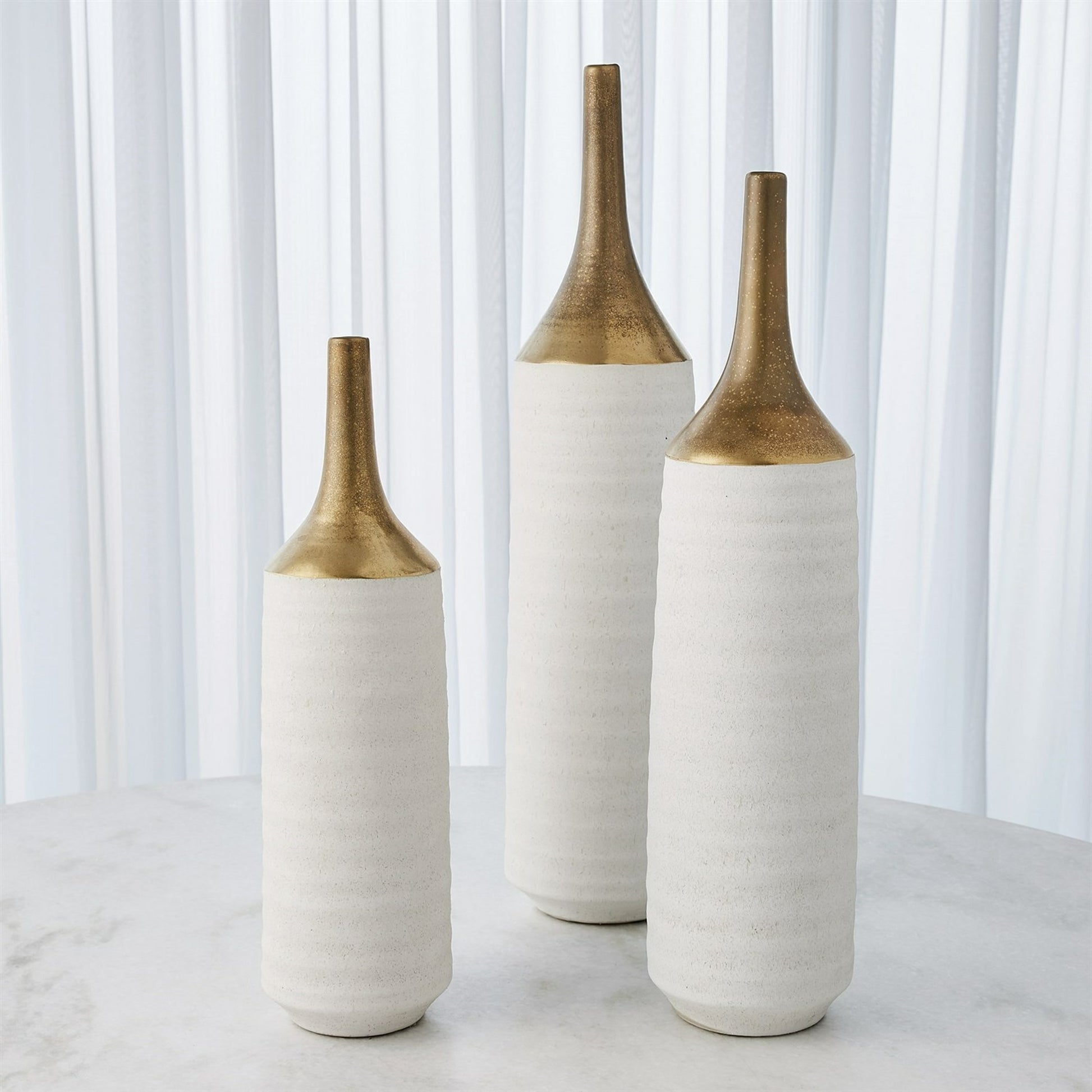 Two Toned Vase by Global Views in gold. Made from ceramic in a eclectic & global style.