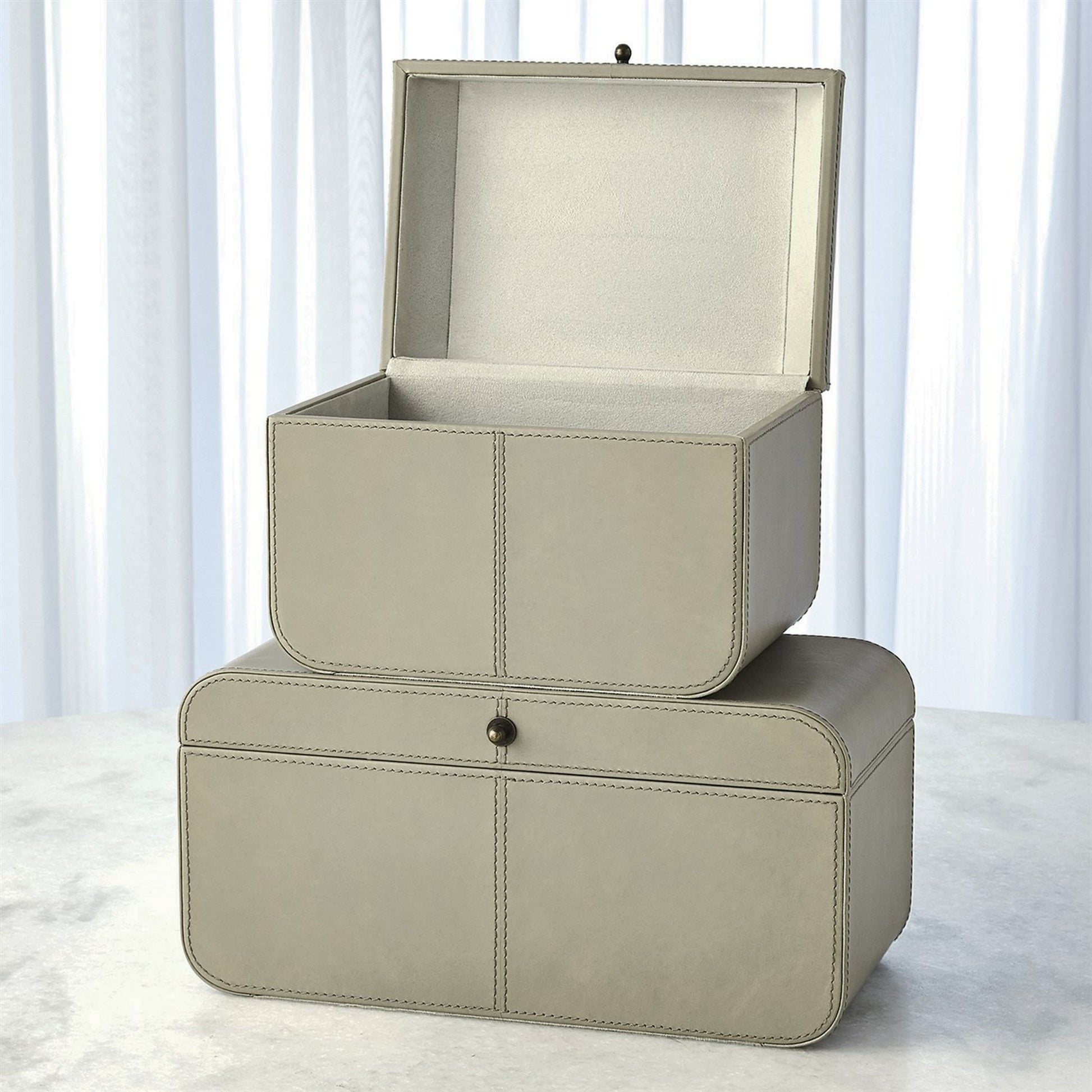 Curved Corner Box by Global Views. Made from mdf, leather, polysuede lining in a eclectic & global style.