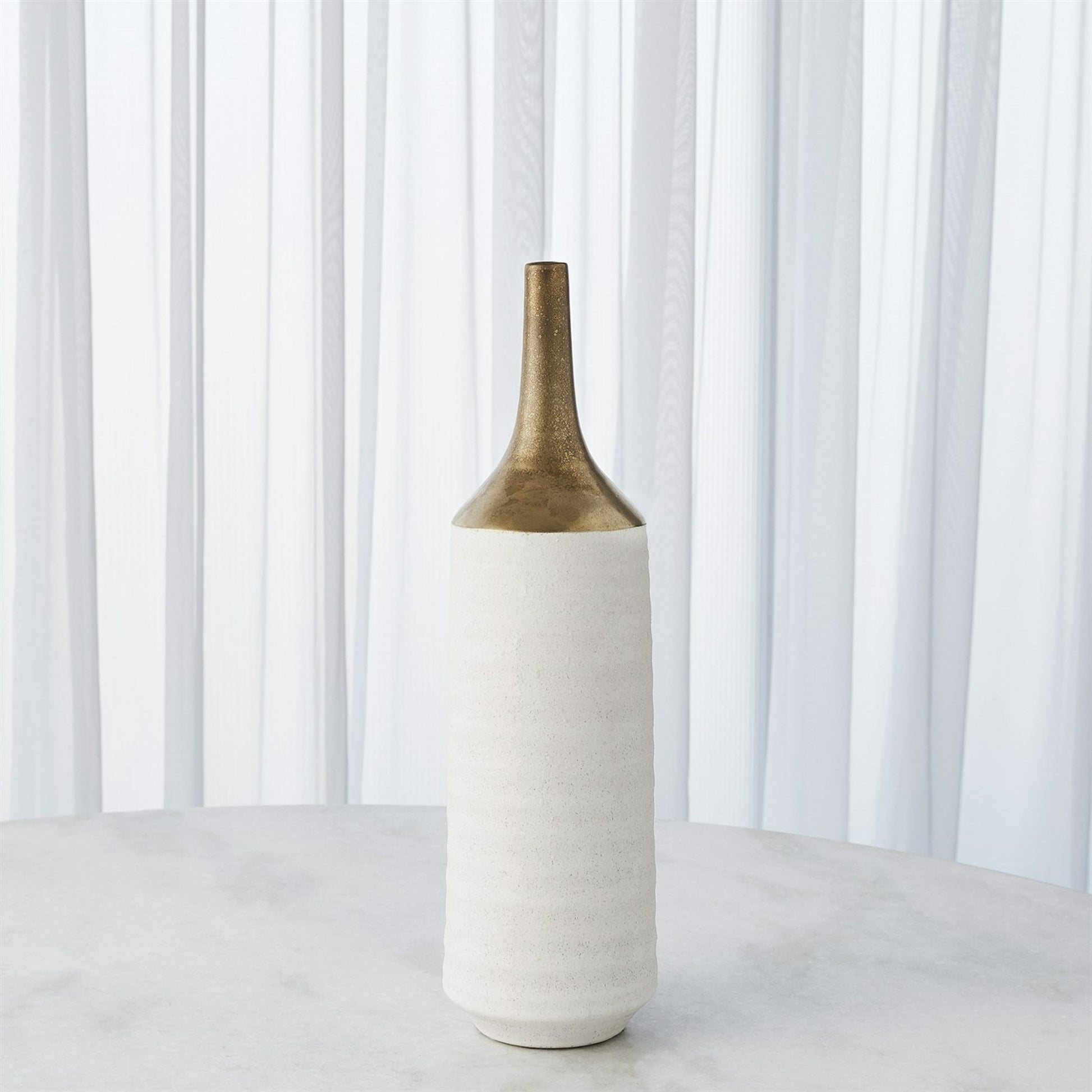 Two Toned Vase by Global Views in gold. Made from ceramic in a eclectic & global style.