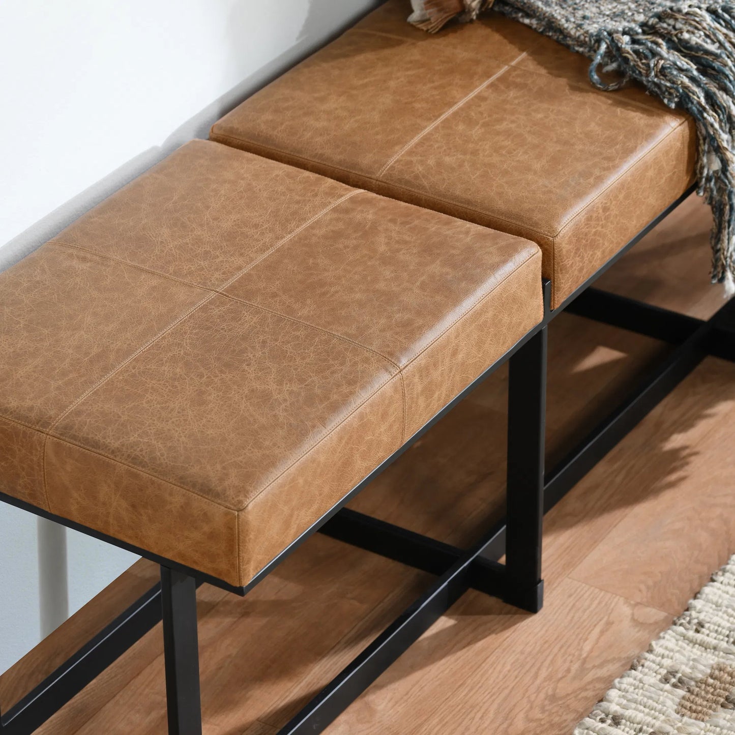 006 SI-2160312 | Closeup | Calvin Narrow Bench by Classic Home in chestnut, black. Made from 100% top grain leather, tube iron in a modern style.