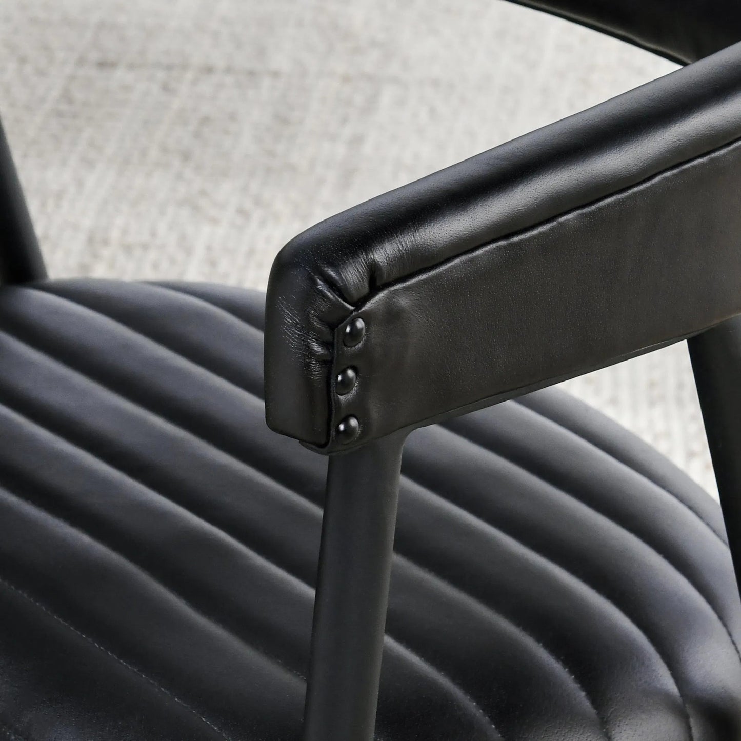 004 SI-2238870 | Closeup | Preston Leather Dining Chair by Classic Home in jet black. Made from top grain leather, iron in a transitional style.